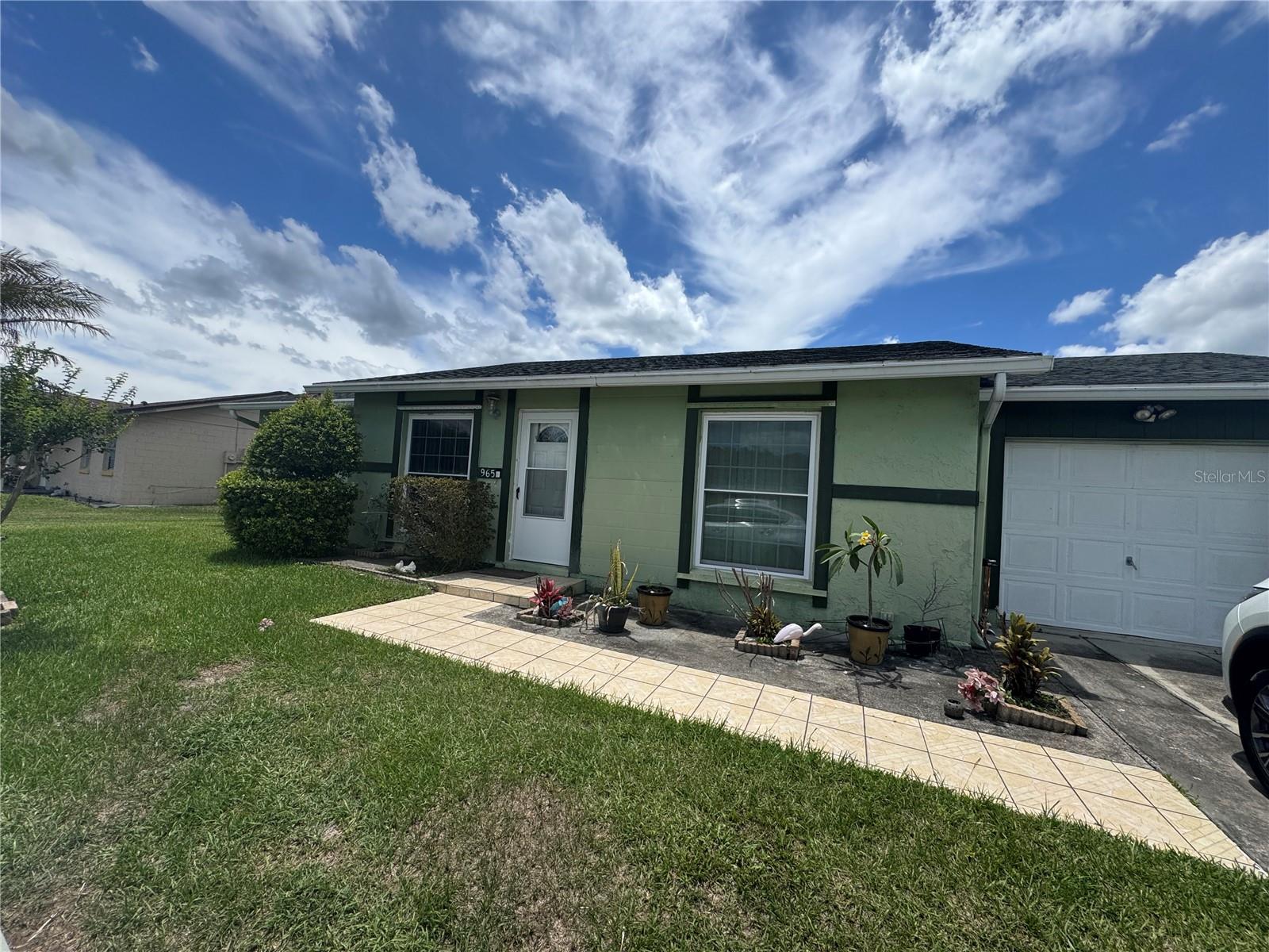 Welcome to this move in ready 2 bedroom, 2 bath home, proudly owned by its original owner. Perfectly situated in a convenient Kissimmee location, the home is just a 5 minute drive to the Florida Turnpike and approximately 17 minutes from Orlando International Airport. **LYNX Route 18 bus stop just 15 steps from the house!!**  As you enter, you'll be greeted by an inviting living and dining room with beautiful, tranquil views of the pond. Sliding glass doors lead to the screened, enclosed porch, providing the perfect spot to relax while enjoying the peaceful waterfront setting. The kitchen also offers picturesque pond views through the window above the sink, making everyday tasks a little more enjoyable. The thoughtfully designed split bedroom floor plan offers privacy, with each bedroom located on opposite sides of the home. Additional features include a whole house water filtration system, a new water heater installed in March 2026, and a roof that is less than 10 years old. Whether you're looking for a primary residence or a low maintenance retreat with serene water views and easy access to major roadways, this home is one you won't want to miss.