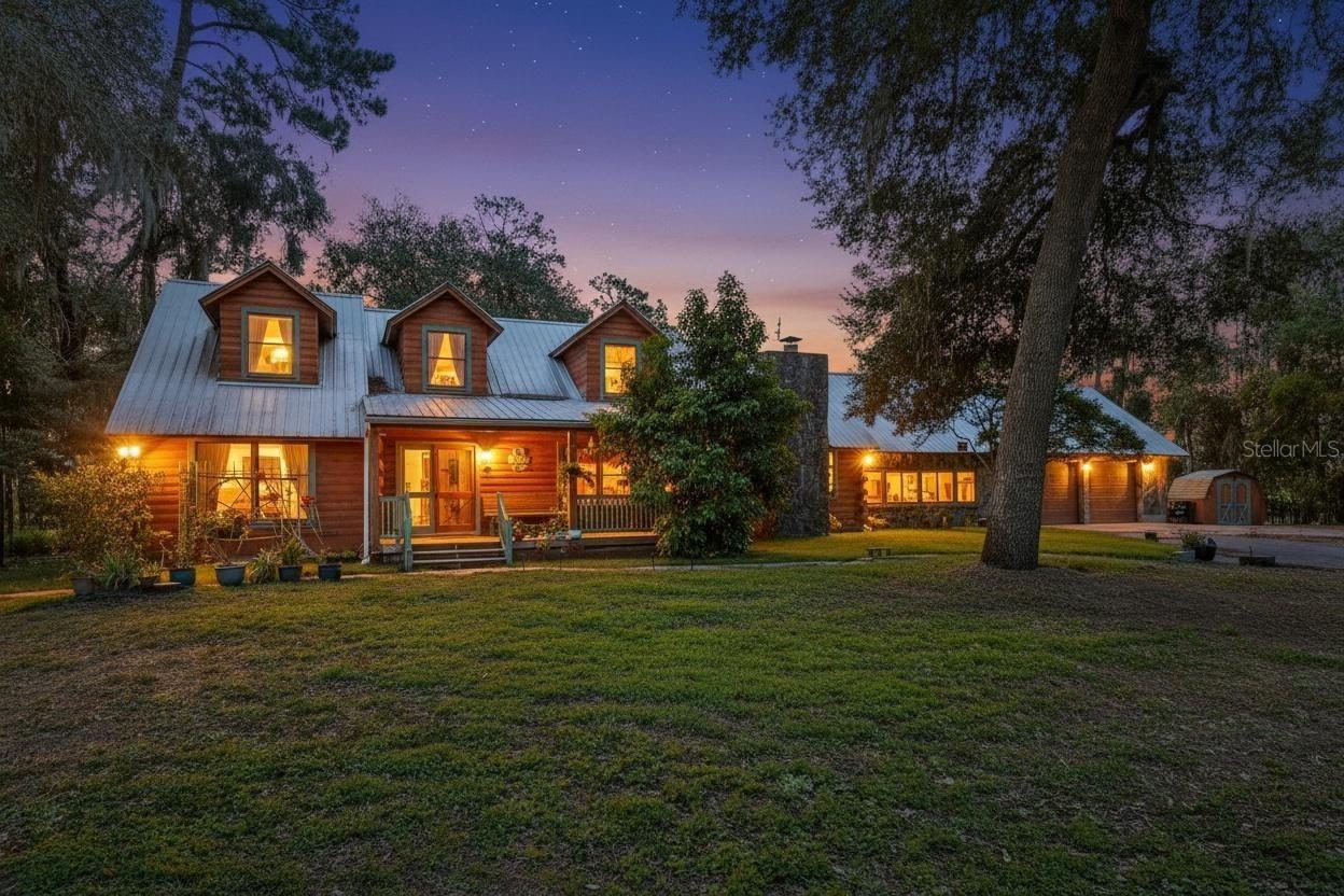 STRAWBERRY FIELDS FOREVER is what you will see from your backyard oasis. Welcome to this beautifully crafted cedar log home nestled on 2.67 acres in the peaceful countryside of Dover. Offering 4 bedrooms, 2 full baths, 2 half baths and 3,471 sq. ft., this unique two story residence blends rustic charm with modern comfort.
Step inside to a warm and inviting interior featuring solid wood finishes, spacious living areas, and abundant natural light. The chef friendly kitchen boasts stainless steel appliances, a large center island with breakfast bar, solid wood cabinetry, and a spacious laundry room with extra storage. The adjoining dining room is anchored by a stunning stone wood burning fireplace, perfect for cozy gatherings.
The expansive first floor primary suite offers true retreat living with French doors opening to a private hot tub area. The ensuite bath features a glass tiled walk in shower, dual vanities, and ample storage.
Upstairs, three additional bedrooms provide plenty of space for family, guests, or a home office. A large bonus room adds flexibility for entertainment, hobbies, or a second living area. So much hidden extra storage areas, and laundry chutes from the Primary as well as the second floor. 
Step outside to your own private oasis — a screened in pool, spacious patio, and wide open acreage ideal for outdoor living, gardening, or future expansion. With no HOA, a 2 car garage, and plenty of room for RVs, boats, or equipment, this property offers freedom and functionality.
Located just minutes from major highways, shopping, and dining, yet tucked away in a serene rural setting, this home delivers the best of both worlds.
A rare opportunity to own a distinctive log home estate in the heart of Dover — schedule your showing today.