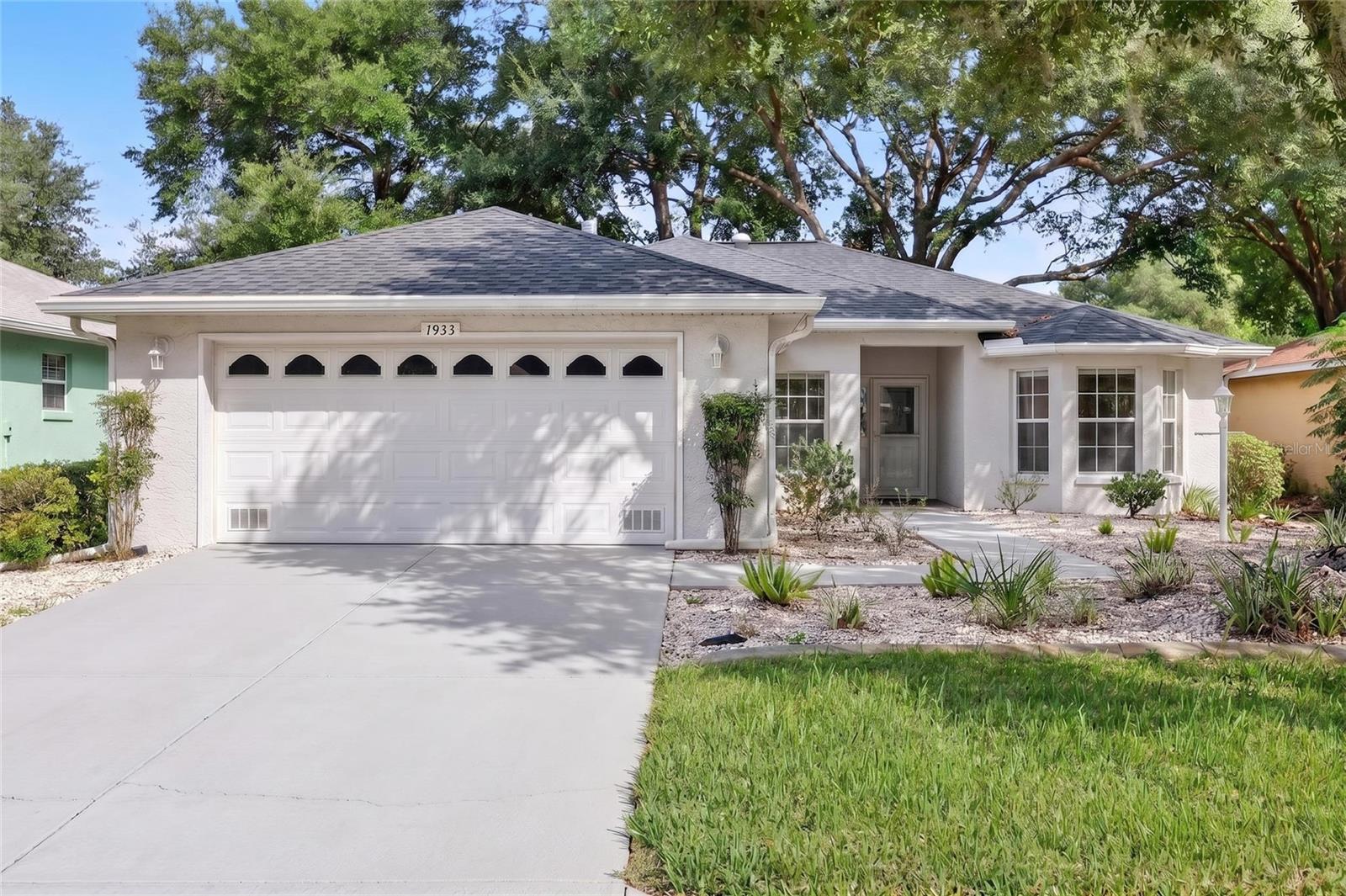Well maintained Verbena model in the Indigo East area of On Top of the World. This is a 3-bedroom with a split floor plan, 2 bathrooms, and a 2-car garage. The kitchen features quartz countertops, subway tile backsplash,  a breakfast nook, eat-at counter and stainless-steel appliances. Tile flooring runs throughout the main living areas, with wood flooring in all bedrooms and tile flooring added to the enclosed lanai. The primary suite offers double closets and a spa-style bathroom with a walk-in shower, while the second and third bedrooms share a nicely appointed guest bath with a tub/shower combination. Additional features include an inside laundry room and gas range, dryer, and heating. Other features include a skylight, tray ceiling, plantation shutters. The large double slider in the back of the home leads to a glass enclosed Lanai under roof that overlooks the private yard. Indigo East is one of On Top of the World's premier communities and residents can enjoy 2 swimming pools, fitness center, clubhouse, as well as curbside mail delivery and waste pickup. For an additional fee, the Gateway Pass provides the option to use the amenities at On Top of the World, where you can enjoy indoor/outdoor pools, 2 restaurants, multiple exercise facilities with plenty of top-of-the-line equipment, water aerobics, yoga, exercise classes, steam and sauna, Pickleball courts, RC plane airport, RC car track, min golf, wood working, 100’s of clubs and continuing education, bocce, horseshoes, shuffleboard, billiards, game room. Social activities galore with great residents. On Top of the World is Ocala's premier, gated, active 55+ community, loaded with amenities and includes golf cart access to three shopping centers.