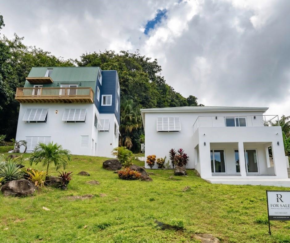 El Yunque Sanctuary: Exclusive Retreat & Nature Connection Project
Located at the foothills of El Yunque National Forest, this property of approximately one acre (one cuerda) represents the perfect opportunity to develop a wellness destination, meditation retreat, or high-end short-term rental concept. The project is 75 completed, offering the competitive advantage of having all construction permits approved, allowing the buyer to finish the work quickly with their own personal touch.
The property features a total of 7 bedrooms and 4 bathrooms across two independent structures, including a captivating wooden Tiny Home with three balconies offering spectacular ocean and mountain views. The land directly borders a crystal-clear creek, creating an unparalleled atmosphere of peace just 200 meters from the entrance to El Yunque. A blank canvas with 4,000 sq. ft. of construction, ready to become the most exclusive refuge in the area.