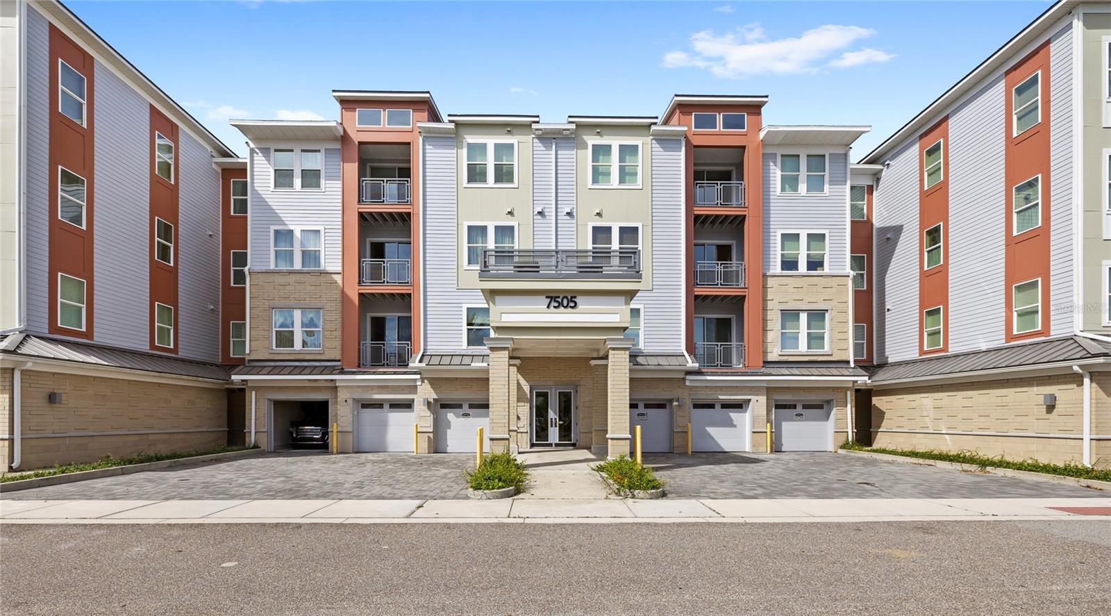 Welcome to The Gatherings® of Lake Nona, a premier 55+ active adult community in the heart of LAUREATE PARK. This light-filled 2-bedroom, 2-bath condominium offers 1,549 square feet of thoughtfully designed living space, complete with a PRIVATE BALCONY, COVERED ONE-CAR GARAGE, and convenient elevator access. The open-concept floor plan features luxury vinyl flooring, a spacious great room, and a beautifully appointed kitchen with 42-inch cabinetry, an induction cooktop, quartz countertops, stainless steel appliances, and a LARGE PANTRY.

Residents enjoy resort-style amenities including a private clubhouse, pool, fitness center, pickleball courts, walking trails, dog park, fire pit areas, and more. Ideally located near Lake Nona Medical City, Orlando International Airport, shopping, dining, and entertainment. HOA dues include cable, high-speed internet, dwelling insurance, exterior maintenance, pest control, window cleaning, and professional management for truly low-maintenance living.