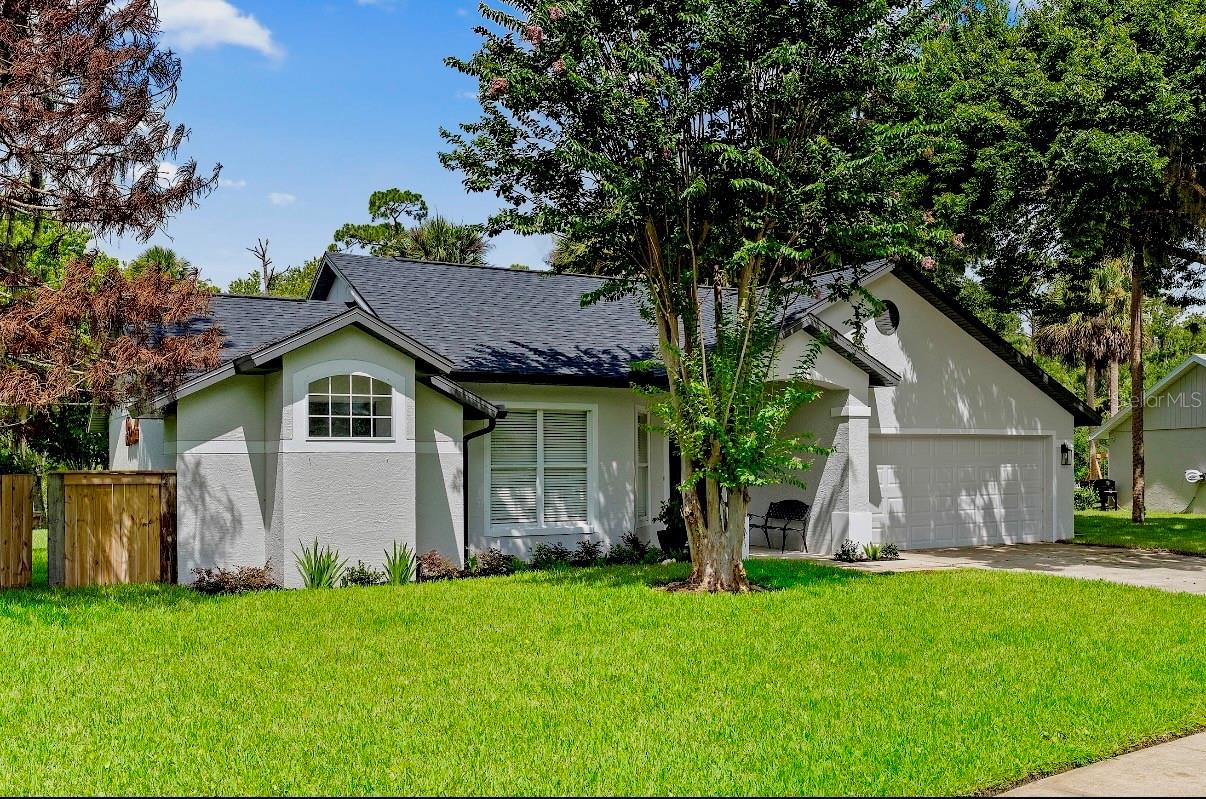 Fully renovated from top to bottom, this 3-bedroom, 2-bath home sits on one of the most private lots in the neighborhood, offering unobstructed lake views from two sides, no rear neighbors, and no neighboring home on one side.

The split floor plan features an open, functional layout with high-end finishes throughout. The kitchen has been completely redesigned with custom cabinetry, quartz countertops, new stainless steel appliances, and generous prep and storage space. High-grade 12mm luxury vinyl plank flooring runs throughout the home, while the family room is highlighted by a custom real stone feature wall, individually laid stone by stone.

Both bathrooms have been fully renovated with quartz countertops, European-style tile, frameless glass shower enclosures, and designer finishes. Every renovation was completed with an emphasis on quality craftsmanship rather than builder-grade materials.

Major updates include a new roof, upgraded privacy fencing, and a new irrigation system with fresh landscaping and sod. The combination of meticulous renovations, exceptional privacy, and expansive water views creates a home that is truly one of a kind