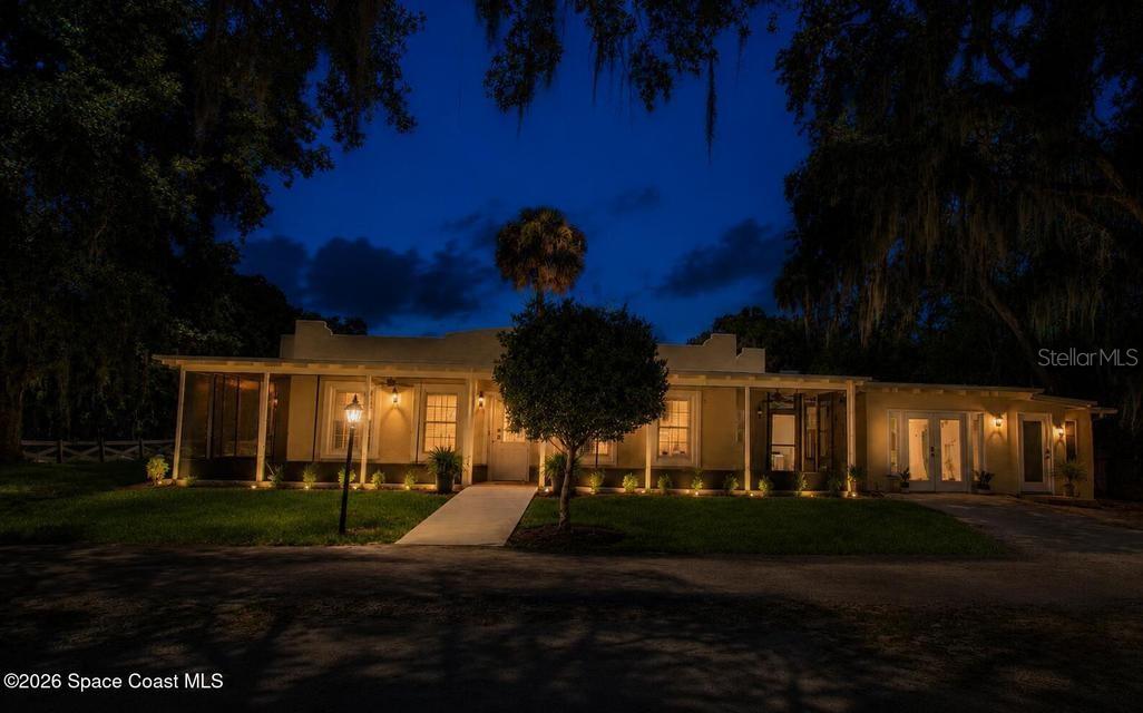 Welcome to this beautifully designed Spanish-style home offering timeless character, exceptional flexibility, and breathtaking views of the Indian River, with the iconic Kennedy Space Center directly across the water. Enjoy spectacular sunrises, rocket launches, and ever-changing waterfront scenery from the comfort of your own home. A standout feature is the spacious private in-law suite, ideal for multigenerational living, extended guests, or potential rental income. Thoughtfully designed with accessibility in mind, the home includes handicap-friendly features that enhance comfort and ease of living. Relax year-round on the expansive screened porch while taking in the tranquil river views and coastal breezes. the property also includes ingress and egress rights to the Indian River, providing convenient access for kayaking, paddle boarding, fishing, or simply enjoying the waterfront lifestyle. A rare blend of character, flexibility and location with water views and access!
