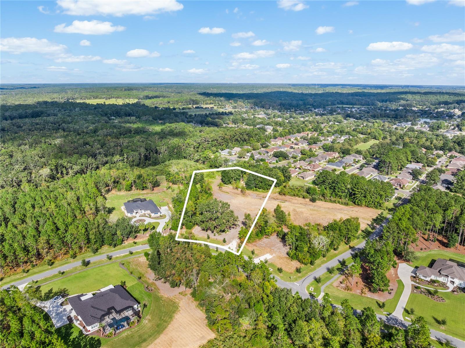 Welcome to the epitome of luxury living in Gainesville, Florida – Lot 14 in the prestigious Kingston community. Prime 3 acre homesite with a South West facing orientation. Pie shaped and fully wooded, Lot 14 offers unparalleled high and dry conditions, ensuring peace of mind for your future home construction. Embrace the serenity of nature with abundant trees surrounding your property, offering privacy and a tranquil atmosphere. Kingston is more than just a community; it's a lifestyle. Nestled in the picturesque NW Gainesville, it features only 24 homesites, ensuring a sense of community while maintaining privacy and exclusivity. Accessible via the scenic County Road 241, you'll be greeted by the majestic backdrop of large southern live oak trees, setting the stage for the grandeur that awaits. Dream big and build the home you've always envisioned. With luxury custom homes ranging from 3,200 to 8,000 square feet, there's ample space to create your masterpiece. Enjoy modern conveniences with Clay electric, underground utilities, well and septic system, and AT&T fiber internet, ensuring a seamless living experience. Indulge in the Kingston lifestyle with paved walking paths and low HOA fees, providing amenities without compromising on the natural beauty that surrounds you. Don't miss this opportunity to live in luxury and create your own Kingston experience.