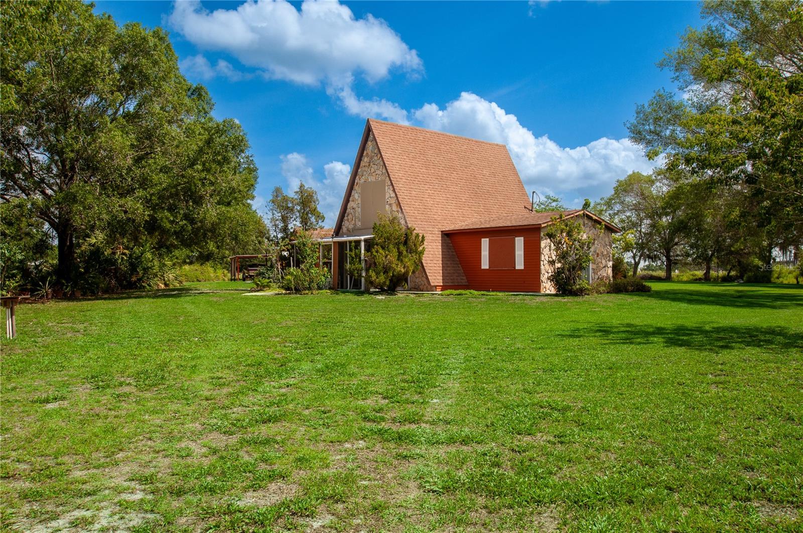 Charming and full of character, this well-built A-frame home at 3740 NE Pitcher Dr in Arcadia offers the perfect blend of rustic charm and country living! Nestled on 1.25± acres , this unique home features an open layout with a loft upstairs that could easily serve as a second bedroom, office, or cozy retreat. The craftsmanship and solid construction make this property truly stand out.

Outside, you’ll find even more possibilities with a detached storage building complete with a full bathroom that could easily be converted into a studio apartment, guest suite, or workshop. Two additional small storage barns provide plenty of room for tools, equipment, or hobbies, while the carport offers convenient covered parking.

Whether you’re looking for a peaceful homestead, weekend getaway, or property with added income potential, this one is packed with opportunity. Enjoy the quiet surroundings and country atmosphere while still being just a short drive from town conveniences. Schedule your private tour today!