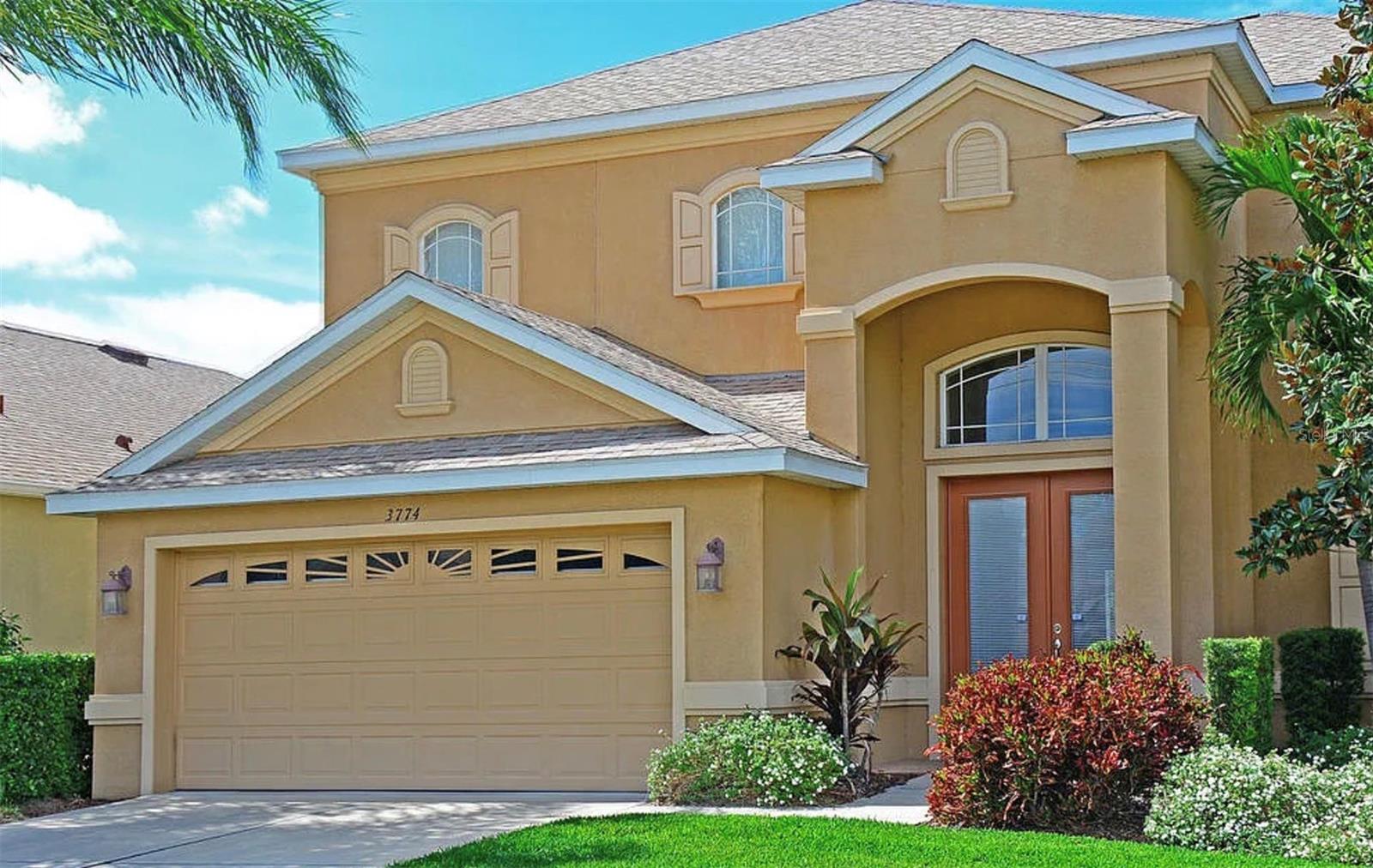 Welcome to 3774 Rainforest Ct., located in the highly desirable community of Palma Sola Trace — one of West Bradenton’s most sought-after coastal neighborhoods known for its unbeatable location, resort-style amenities, and close proximity to everything that makes Florida living so special. Ideally located just minutes from Anna Maria Island, Palma Sola Trace offers convenient access to some of the area’s best restaurants, shopping, parks, and outdoor attractions. Enjoy nearby Robinson Preserve, Neal Preserve, and the Palma Sola Causeway, where kayaking, paddleboarding, boating, fishing, and beautiful Gulf Coast sunsets are part of the everyday lifestyle. The location also provides easy access to IMG Academy, downtown Bradenton Riverwalk, and Sarasota’s renowned dining, arts, and entertainment scene. Residents enjoy a low-maintenance lifestyle with beautifully maintained grounds, a resort-style community pool, clubhouse, fitness center, and playground.
Pool homes in Palma Sola Trace rarely become available, making this spacious five-bedroom residence a unique opportunity within the community. Situated on an oversized lot of nearly a quarter acre, this well-maintained two-story home offers over 3,000 square feet of comfortable living space with an open and functional layout ideal for both full-time living and entertaining. The main living areas feature tile and carpet flooring and abundant natural light, while the kitchen offers granite countertops, stainless steel appliances, ample cabinetry, and both casual and formal dining spaces. The first-floor primary suite provides privacy and generous space with dual walk-in closets, dual vanities, soaking tub, and separate shower. An additional downstairs bedroom offers flexibility for guests, office space, or multi-generational living. Upstairs, additional bedrooms provide comfortable accommodations for family and visitors alike. Sliding glass doors lead to the screened outdoor living area with a private heated pool — the perfect setting to enjoy Florida’s year-round sunshine. While some cosmetic updates could further enhance the home and allow a new owner to add their own style and vision, the property has been well cared for and presents exceptional value in one of the area’s most desirable locations. Located in a no-flood zone where flood insurance is not currently required, this property combines space, location, lifestyle, and long-term potential — all just minutes from the Gulf Coast’s most loved destinations.