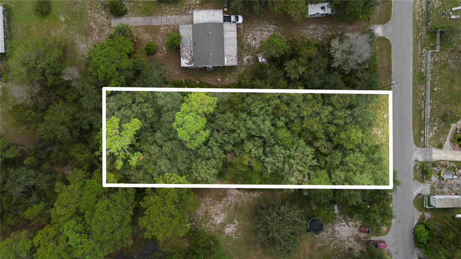 Looking for the perfect spot to build your peaceful retreat by the water? This lot, located in the unincorporated area of Paisley, is just what you’ve been searching for. Measuring approximately 150 by 108 feet, it sits tucked away on a private drive off County Road 42. Spend your days picnicking or boating at Ed Stone Park and Boat Launch, swimming in the crystal-clear waters of Alexander Springs, or exploring the scenic trails nearby. Then unwind with a relaxing dinner at St. John’s River Grille. With serene water views and easy access to Central Florida’s natural beauty, this property offers the ideal setting for your getaway dream.