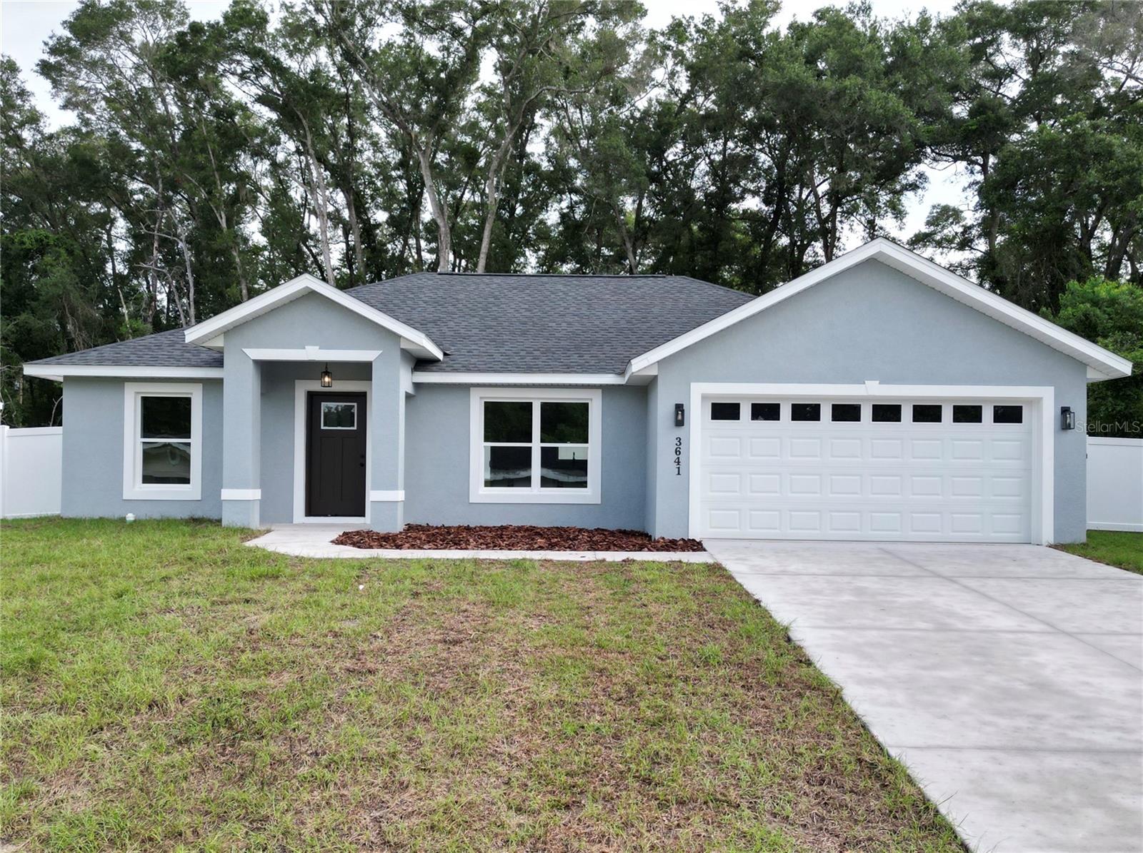 Brand-new concrete 3-bed, 2-bath home featuring a bright open floor plan, premium vinyl flooring, tiled showers, and a kitchen with premium finished cabinetry and quartz countertops. Enjoy abundant natural light, a generous backyard with vinyl privacy fence, and durable low-maintenance finishes throughout. Ideal location — convenient to Ocala, Belleview and The Villages.
