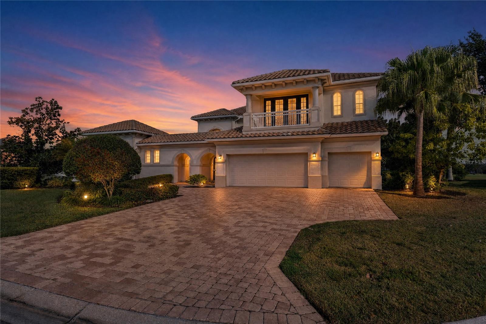 Stunning water and golf course views define this exceptional estate in the prestigious Waterlefe Golf & River Club, where refined luxury meets resort-style living. Designed for grand entertaining and everyday comfort, this expansive residence offers six bedrooms, five and a half baths, two primary suites located on both the main and upper levels, a private gated courtyard entry, and a separate one-bedroom casita with full bath, ideal for guests or multigenerational living. The interior showcases soaring vaulted ceilings, an impressive circular staircase, custom ceiling beams and accent wall features, luxury LVP flooring throughout, a dedicated movie theater and game room, and a chef’s kitchen featuring quartz countertops, a double waterfall island, Fisher & Paykel appliances, a 40-inch gas range, butler’s pantry, wine room, and custom built-ins, all flowing seamlessly into the great room with fireplace. The first-floor primary suite is a true retreat with dual baths and generous custom walk-in closets. Outdoor living is unmatched with a fully built-in outdoor kitchen with gas appliances, an oversized yard with turf accents, and a breathtaking saltwater infinity-edge pool with custom waterfall, all overlooking private, unobstructed canal views. Boating enthusiasts will appreciate the private dock with lift providing direct access to the Manatee River and the Gulf of Mexico. Additional highlights include three new A/C units, tankless water heater, all-new pool equipment, fresh interior and exterior paint, cul-de-sac location, and an amenity-rich Waterlefe lifestyle offering championship golf, marina, riverfront clubhouse dining, resort-style pool, fitness center, pickleball and tennis courts, scenic trails, and close proximity to Lakewood Ranch, UTC, Sarasota, and world-class Gulf beaches.