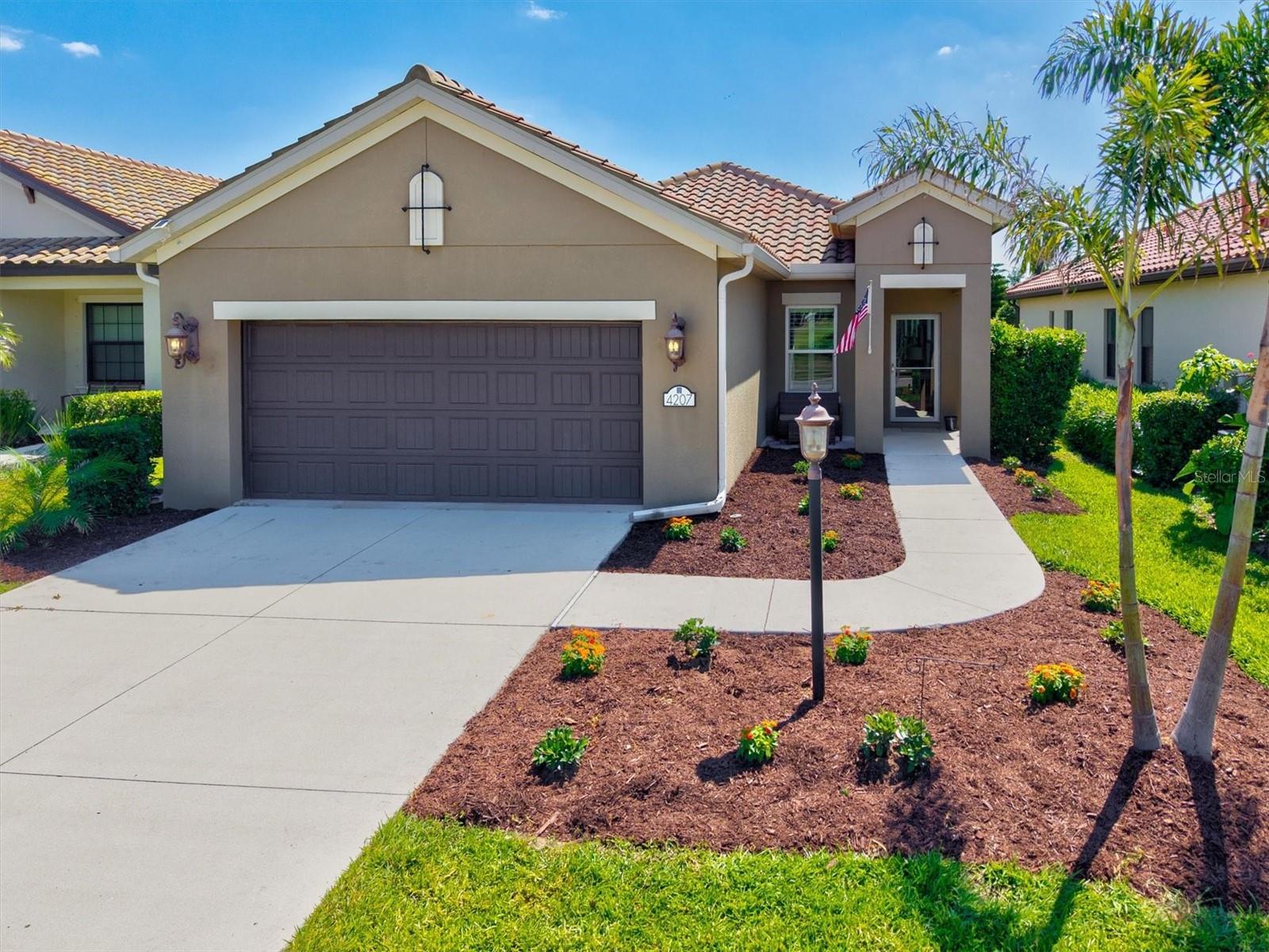 NO CDD FEE! This beautifully maintained 3-bedroom, 2-bath Neal Patriot model offers 1,682 sq ft of thoughtfully designed living space with serene pond views and enhanced backyard landscaping for added privacy. The open-concept layout features a stylish kitchen with granite countertops, gas stove, stainless steel appliances, and a versatile microwave convection air fryer. A custom farm-style pantry door with built-in shelving adds both charm and functionality. The spacious owner’s suite includes custom closet shelving, providing smart storage solutions. Enjoy peaceful mornings and evenings on the water-view lanai, perfect for relaxing or entertaining. This home combines comfort, upgrades, and value in a sought-after Indigo community. Enjoy exceptional resort-style living with access to a beautifully appointed clubhouse, sparkling pool, fitness center, and pickleball courts. Ideally situated just minutes from top shopping, premier golf courses, dining, and major roadways for ultimate convenience. Make this home yours today!