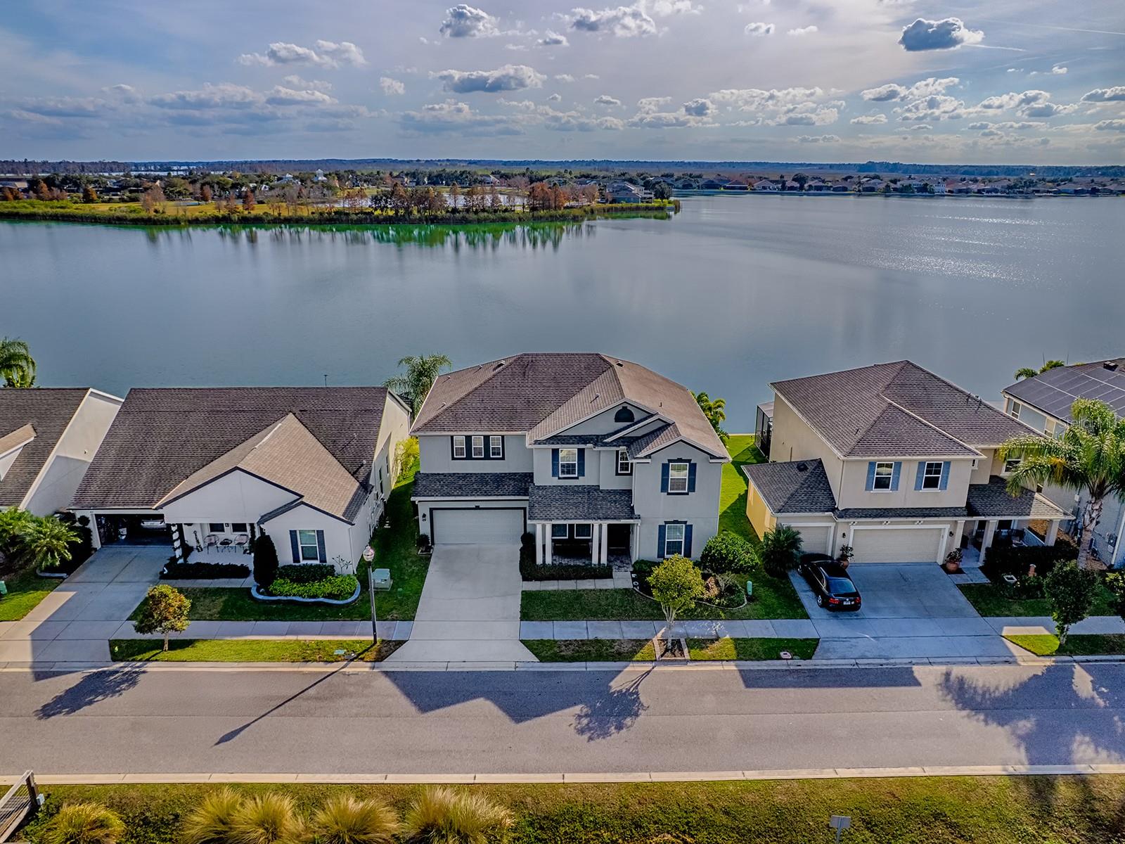 Exceptional Waterfront Opportunity! Discover a truly unique opportunity to own a luxury waterfront residence perfectly positioned between two beautiful bodies of water—a peaceful lake behind the home and a navigable canal in front, with direct access to the Clermont Chain of Lakes. This property delivers an exceptional lifestyle for boating, fishing, both sunrise and sunset lovers!

This elegant 4-bedroom, 3.5-bath single-family home features an open, light-filled layout designed to showcase water views from nearly every window. The brick-paved, oversized screened lanai provides the perfect setting for enjoying spectacular sunsets every evening. The first floor includes a formal dining room, a dedicated office with stylish barn doors, and the gourmet kitchen boast updated appliances, stunning countertops, and a layout ideal for both everyday living and entertaining. Also there is an oversized three-car tandem garage with space for vehicles and a golf cart. Upstairs, the expansive primary suite is an elegant private sanctuary, showcasing breathtaking lake views and two spacious walk-in closets. The spa-inspired primary bathroom elevates the experience with dual vanities, a deep soaking tub, an oversized walk-in shower, and serene, panoramic views of the lake. The second bedroom offers the convenience of its own private en-suite bath, while bedrooms three and four share a well-appointed Jack-and-Jill bathroom. Together, these additional guest bedrooms complete the second floor, providing comfort and privacy for family and visitors alike.


Located within the gated waterfront community of Waterside Pointe, residents enjoy a vibrant, family-friendly atmosphere featuring a huge resort-style pool, waterslide, golf cart parades, boat parades, food-truck nights, and convenient RV and boat storage. It’s also the closest gated community to Downtown Clermont, offering quick access to shops, restaurants, entertainment, and waterfront events.



With the ability to build your own private dock and enjoy direct lake access, this home offers the full lakefront lifestyle!