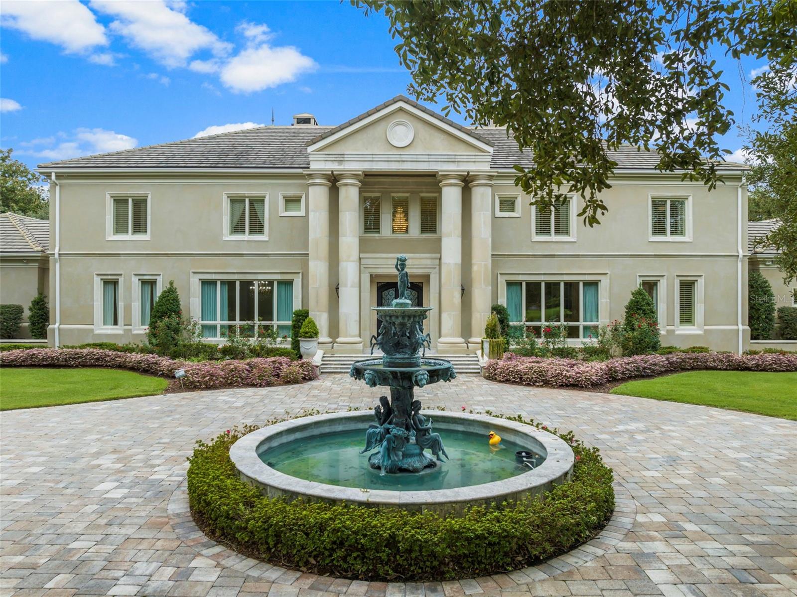This exclusive Waterfront luxury Estate is situated on a private 4.5 acre lot, surrounded by beautiful landscaping and majestic oak trees. With over 281 feet of deep water frontage on Joe's Bayou, this hidden gem is located in the heart of Destin. The spacious home offers a range of luxurious features.

The master suite wing provides a serene retreat, featuring a bedroom with a large sitting area, a cozy fireplace, a generous dressing closet room, an exercise room with full-length mirrors, and an Italian marble tile master bath. Start your day with ease at the convenient coffee bar within your suite while enjoying breathtaking views of Joe's Bayou.

The grand room impresses with its soaring ceiling, stone floors, and French doors that open to an area with a heated pool and spa overlooking the bayou. For the culinary enthusiast, the gourmet kitchen is a chef's dream. Equipped with high-end appliances, a pantry for all your culinary delights, and a butler's pantry for seamless entertaining, this kitchen is both stylish and functional with stone floors and granite counters.

On the second floor, you'll find an entertainment living room complete with a full-size bar, ice maker, bar refrigerator, and media area. Additionally, there are five bedrooms on this floor. The estate also offers a sandy beach, a fire pit area, and a deep-water dock with two large deep water boat slips. One of the slips even includes a 40lb. lift capable of accommodating a 55' boat.

Every plant and tree on this meticulously manicured estate has been hand-selected. Other notable features include a handicap-ready bedroom and bath on the first floor, a central surround sound system, a Smart Home system, a large heated pool, and much more.

Embrace the seamless blend of indoor and outdoor living as you enjoy the picturesque surroundings of Joe's Bayou. Whether you're entertaining guests or savoring a quiet moment, this property offers a lifestyle that is nothing short of extraordinary.