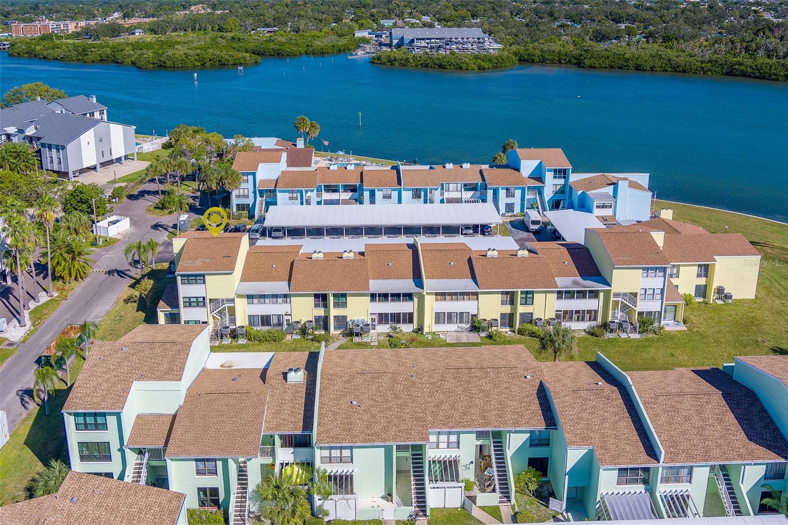 Windrush Cove is a waterfront community on the Intracoastal Waterway. This 2 bedroom, 2 1/2 bath end unit townhome is light & bright and well maintained. Separate living and dining areas. All appliances including microwave, washer and dryer. Enclosed balconies and storage area. Covered parking. Clubhouse with library, table tennis, party area, shuffleboard - all on the water with great views. Discover the quaint city of Indian Rocks Beach!