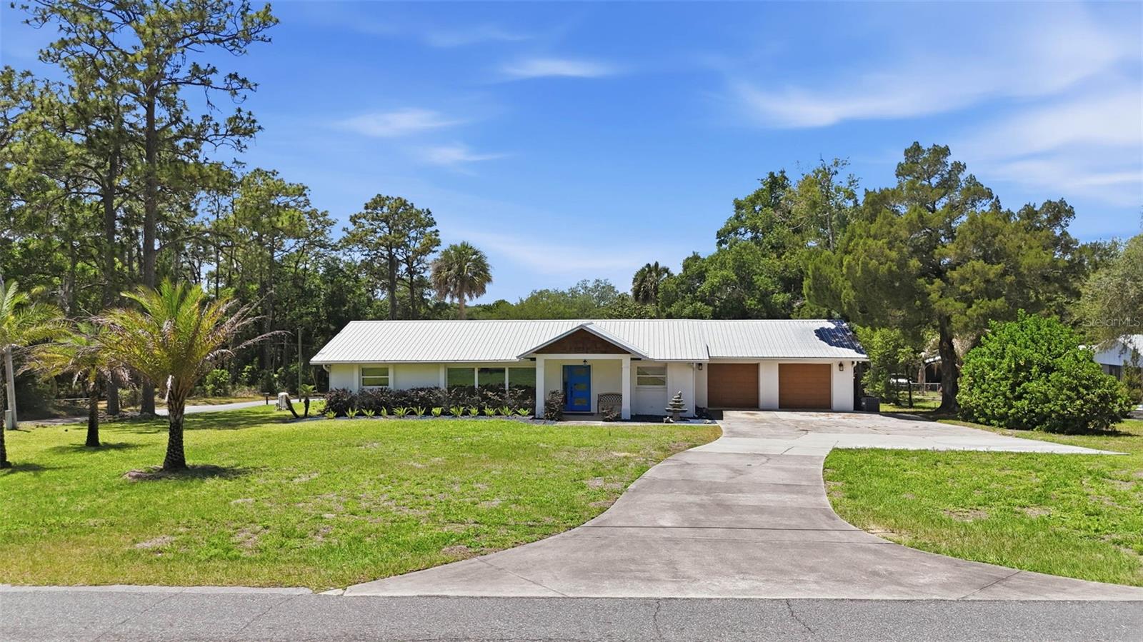Charming pool home on over half an acre!  No HOA. Open spaces and relaxing places.  This home delivers on every level.  With 4 Bedrooms and 3 full bathrooms this home is perfect for the family, multi-generational living or entertaining guests.  There is plenty of room to gather in the kitchen and Great Room as well as a separate Family room for a cozier atmosphere.  Enjoy the Florida weather on the screened porch or out by the swimming pool.  The pool area is fenced in for privacy and the electrical hook up is there for a hot tub.  
This home is rich in standout features, designer touches and custom built-ins.  The metal roof is sure to please.  The 2-car garage has ample workspace and a window A/C unit.  The extra-long driveway with extended parking pad provides plenty of room for all of your vehicles.  
This area of Lake County is what Central Florida is all about.  You cannot beat this location if you are a nature lover.  Lake Griffin State Park is only 3.5 miles away and Herlong Park is 7 miles.  Both have boat ramps, fishing piers and picnic areas.  Also in the area are Alexander Springs, Ocala National Forest, Lake George State Forest and Lake Harris on the Harris Chain of Lakes.  The Villages is a short 15 minute drive and there you have shopping, dining, medical, golf and the Sharon L Morse Performing Arts Center.  Central Florida is also home to multiple Theme parks, Downtown Orlando, Gulf Coast and East Coast beaches and the renowned Kennedy Space Center.  
This home is a must SEE!  Book your private tour today.