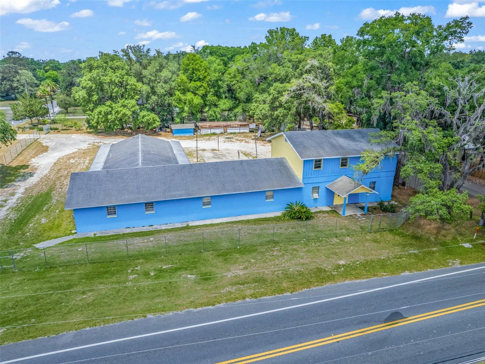 Price Improvement! Versatile 6,700+ Sq. Ft. Mixed-Use Building – Prime Location!
    Endless possibilities await in this multi-purpose property offering over 6,700 sq. ft. of space with excellent visibility on a busy street. Conveniently located near US Hwy. 27, Hwy. 301, Hwy. 441, Hwy. 484, and I-75, this R-4 Mixed Residential-zoned building is ideal for residential, commercial, or institutional use.
    The ground floor features a spacious 3-bed, 2-bath apartment, a fully equipped kitchen, a large workshop, multiple offices, a reception area, ample storage, and two public bathrooms. Upstairs, a private 3-bed, 1-bath apartment includes a great room and a bonus space perfect for a walk-in closet or kitchenette.
    Outside, enjoy plentiful parking and flex space ready for customization. Formerly a Religious Center, permitted uses include single or two-family residences, professional offices, daycare, rehab center, public lodging, and more. Recent updates include a new roof (2015), HVAC upgrade, chain-link fence (2019), septic drain field (2021), and well pump (2021).
    With a little TLC, this property can become a thriving hub of activity. Don’t miss this unique opportunity—schedule a tour today! Owner financing available.