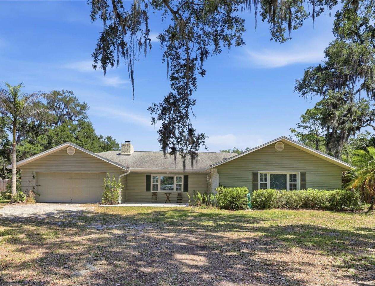 A RARE find in Sarasota or Manatee County! This property has an Open Use zoning classification, which allows for a variety of uses beyond residential, and has no deed restrictions. This 2,129 sq ft pool home sits on some of the most private acreage in the area. The fenced property also includes a separate concrete building with power and water, ready to be finished to your specifications. The property backs up to a 77-acre protected preserve, ensuring privacy for years to come. Ideally situated West of I-75 and just a short distance to both downtown Sarasota and the shops and restaurants of University Town Center.