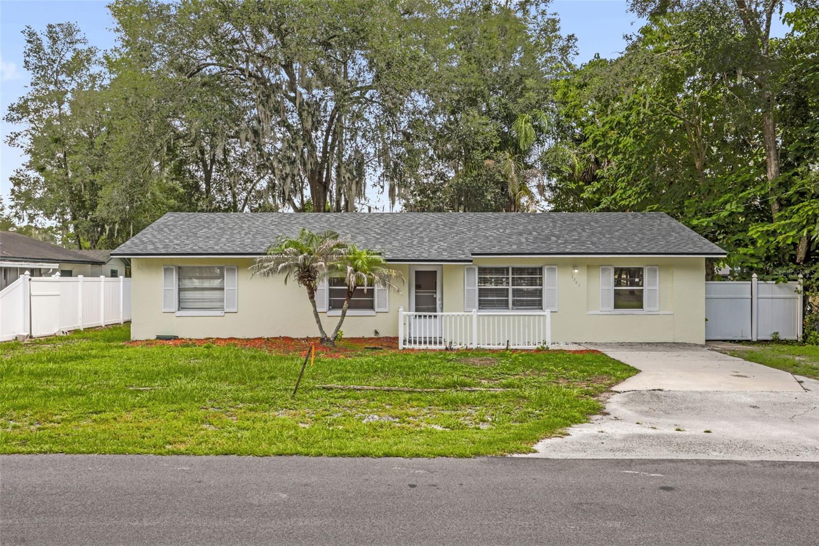 Perfect starter home in a great DeLand location! This spacious 3-bedroom, 2-bathroom residence features an inviting open floor plan with tile flooring throughout, two full baths, and a convenient inside laundry room. The large family room flows seamlessly into the generous kitchen, which includes a walk-in pantry with lots of shelving and space for an extra refrigerator. Additional highlights include a split bedroom plan with an extra-large primary suite, a screened-in porch overlooking the backyard, and a large fenced yard complete with a storage shed. A new roof was installed in March 2026. This home offers excellent features including handicap ramps, a generator hookup, recently paved roads, new fiber optics, and outstanding drainage. The two-tier backyard is fully shaded with boat/RV parking and a drive-thru layout. Residents enjoy a community boat ramp nearby, plus easy access to elementary and high schools. Conveniently located near Lowe’s, Walmart, and a hospital—all within 2-3 miles—while benefiting from a vacant rear lot for added privacy. This move-in ready home, with excellent nighttime lighting, offers tremendous value for first-time buyers or investors. Don’t miss out!