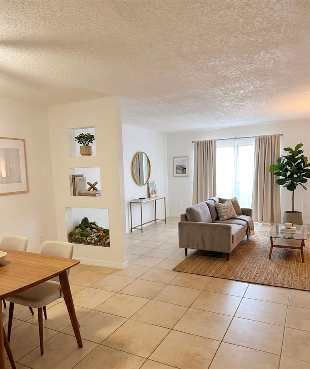 Welcome to this bright, spacious, and beautifully illuminated 1-bedroom, 1-bathroom corner unit! This exceptionally convenient condo features an open and ample layout, highlighted by a large bedroom complete with a generous walk-in closet, plus the added convenience of an inside washer and dryer tucked away in a dedicated laundry closet. Step outside through your rear patio door to enjoy your private patio space, offering direct, seamless access to your assigned parking space and the refreshing community pool. The property includes 1 assigned parking spot with plenty of additional visitor parking available for guests. Perfectly situated and ready to move in—schedule your tour today!