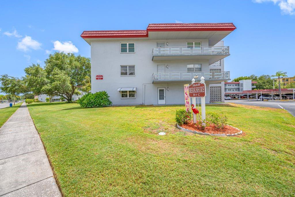 Start living the Florida lifestyle you’ve been dreaming of!   Welcome to this MOVE-IN READY, GROUND FLOOR one-bedroom, one-bath condominium with assigned CARPORT #58 in the Berkshire Building of Five Towns. Step inside to a bright and inviting open-concept living and dining area filled with natural light. The beautifully updated kitchen features elegant quartz countertops, stainless steel appliances including a gas range, abundant cabinetry, and stylish subway tile backsplash. The spacious bedroom (approx. 14’ x 10.5’) offers direct access to the versatile Florida Room and convenient access to the updated bathroom, which features a step-in shower, new vanity, mirror, lighting, and toilet. Updated with impact windows and an exterior door (both installed in 2021), the Florida Room is flooded with natural light and provides the perfect flex space for a home office, hobby room or guest accommodations.  Attractive barn doors create a seamless transition between the Florida Room, kitchen and bedroom. Additional updates include continuous wood-look plank tile flooring and new remote controlled lighing/ceiling fans throughout.  Whether you’re looking for a full-time residence or a “lock-and-leave" Florida retreat, this home is ready for you.  Five Towns is a vibrant 55+ community providing an exceptional array of amenities and allows one cat or one dog (up to 25 lbs). Residents enjoy access to the main clubhouse, Magnolia Sun Center, on 58th Avenue N. Including a fitness center, billiards room, community room,  library, tennis, pickleball, shuffleboard, bocce ball, pool, spa and more!  In total, there are 6 crystal clear pools on site! The monthly fee of $558.24 includes cable, internet, recreational facilities, natural gas, maintenance, professional management, water, sewer, trash, and the building’s central water heater. The Berkshire Building is 100% Funded and all required milestone inspections have been completed for added peace of mind.  Additional conveniences include a second-floor laundry facility, ground-floor storage cubby, and bicycle storage. Plenty of sunshine, beautiful sunsets and lush tropical landscaping - this is a perfect place to call home. Ideally located close to shopping, dining, medical facilities, and our beautiful beaches.  Please plan to preview today!