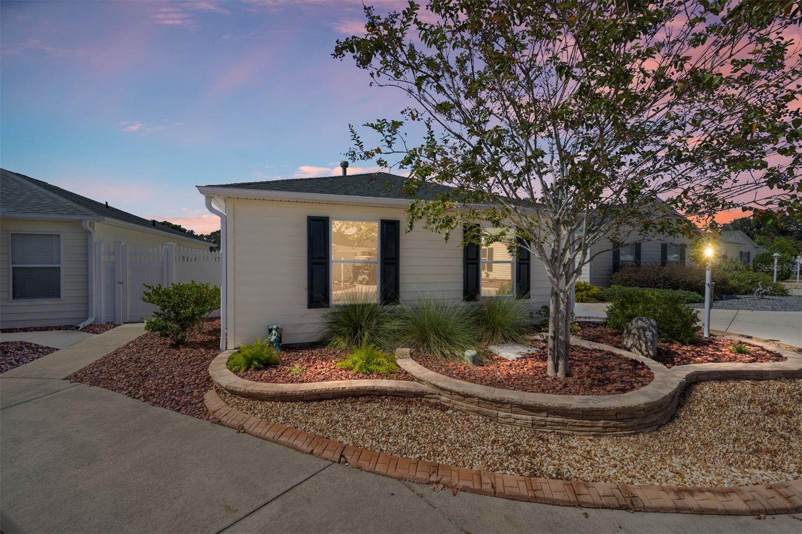 ABSOLUTELY GORGEOUS VILLA IN VERY DESIREABLE NEIGHBORHOOD.  Viilla Escandido is located close to the Savannah Center, Glenview, The Polo Club, Route 466 shopping, The Hospital and medical offices.  A 15 minute golf cart will get you to either Sumter Landing or Spanish Springs town square.  Painted Driveway with stacked landscaping in front of home with a beautiful crepe myrtle.  ROOF 2020, HWH 2021, HVAC 2015.  The kitchen has been totally updated with new cabinets with pullouts, slow close and under cabinet lighting.  Quartz counters with a farmers sink and beautiful backsplash.  Brand new GE Refrigerator and newer appliances.  Luxury Vinyl Plank Floors throughout the home as well as plantation shutters.   There is NO POPCORN!!  Double pane windows were installed in 2019. Guest bathroom has new sink, quartz counters and toilet. Master Bathroom has new quartz counters, sink, toilet and a new shower with a beautiful glass door.  The lanai is enclosed and has vinyl flooriing.  The backyard is perfect for entertaining.  Outdoor kitchen with grill and sink, huge gas firepit with 4 chairs, Beautiful outdoor furniture which will convey with the sale of the home.  The yard is maintenance free as there is drip watering in place.  Termite protection is also in place......all this plus NO BOND!!  Call me to schedule your private showing before this beauty is gone!