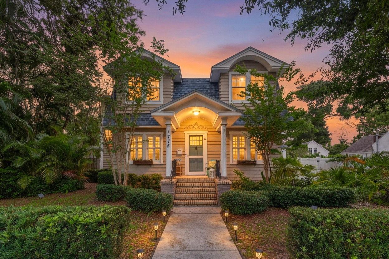 Located on a picturesque brick-lined street in Crescent Heights, this Colonial-style home sits on a rare 75' x 127' lot. From the moment you walk in, you'll appreciate the timelessness that makes these homes so special - beautiful hardwood floors, a gas-burning fireplace, custom built-ins, plantation shutters, and spaces that simply feel warm and inviting. The formal dining room flows into the spacious living area, making it ideal for entertaining and everyday life. The kitchen offers both island seating and a cozy breakfast nook, while one of the most practical features of the home is a first-floor bedroom and full bathroom. Upstairs, you'll find a spacious loft that functions as a second living area, playroom, media room, or flex space, along with a generously sized primary suite featuring a renovated en-suite bathroom and walk-in closet. Step outside and you'll quickly understand why homes like this rarely come available. The backyard feels like your own private retreat with a beautiful pool, expansive paver deck, mature landscaping, and plenty of green space left over for kids, pets, gardening, or simply enjoying the outdoors. It's increasingly hard to find this kind of lot size and usable yard space this close to downtown St. Pete. Adding even more flexibility is the detached oversized garage with epoxy floors, alley access, room for boat parking, and a separate bonus room that's ideal for a home office, gym, studio, or hobby space. Recent improvements include a new roof (2023), new HVAC system (2022), tankless water heater, updated pool equipment, and the garage/office addition completed in 2017. All of this is just minutes from downtown St. Pete, Crescent Lake Park, Coffee Pot Bayou, Trader Joe's, Fresh Market, Rollin' Oats, and the restaurants, breweries, and shops of the Grand Central District. Best of all, it's located outside of a flood zone, meaning no flood insurance is required. This is the kind of Crescent Heights property buyers wait for—character, space, a pool, a detached office, and a lot size that's becoming harder and harder to find.