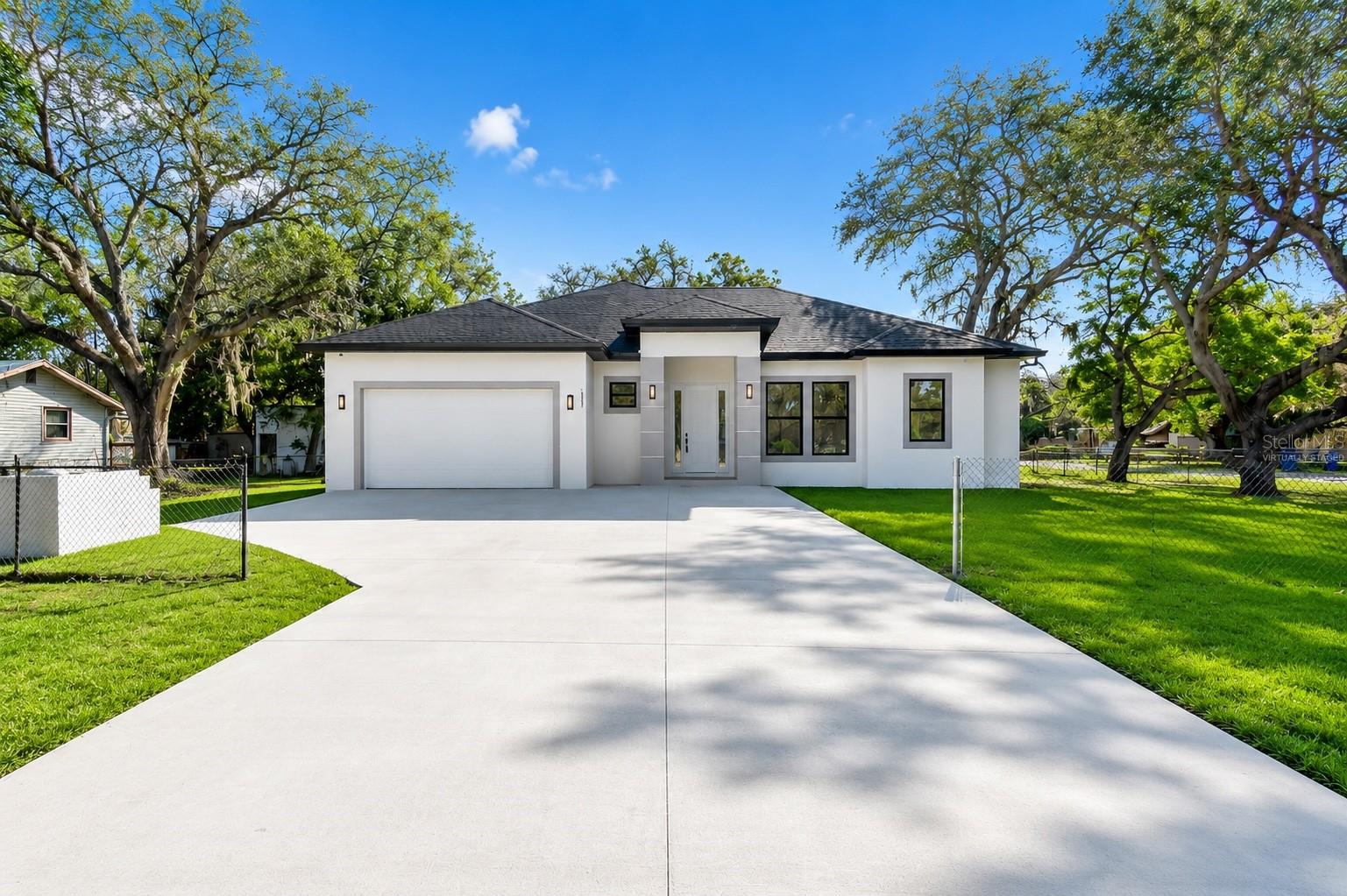 Welcome to 15101 N 19th Street, a newly completed custom residence where quality, craftsmanship, and thoughtful design come together seamlessly. Built with an uncompromising attention to detail, this home showcases exceptional finishes, modern functionality, and a level of execution rarely found in today's new construction market. Every finish, fixture, and design element was selected with purpose, creating a home that feels both refined and timeless. Soaring ceilings, expansive living spaces, and carefully curated details deliver a sense of quality that is immediately apparent from the moment you step inside. Unlike many new construction homes built to meet a price point, this residence was built to exceed expectations.

This home delivers the confidence that only brand-new construction can provide. Featuring a newly installed septic system, integrated security cameras, exterior flood lighting, and entirely new mechanical and structural components throughout, every aspect of the property has been completed with longevity, convenience, and peace of mind in mind. Simply move in and enjoy knowing that the work has already been done.

Ideally located in the heart of Lutz with convenient access to shopping, dining, major roadways, and everything the Tampa Bay area has, this is a rare opportunity to own a truly turnkey new construction home where no detail was overlooked and no corners were cut.