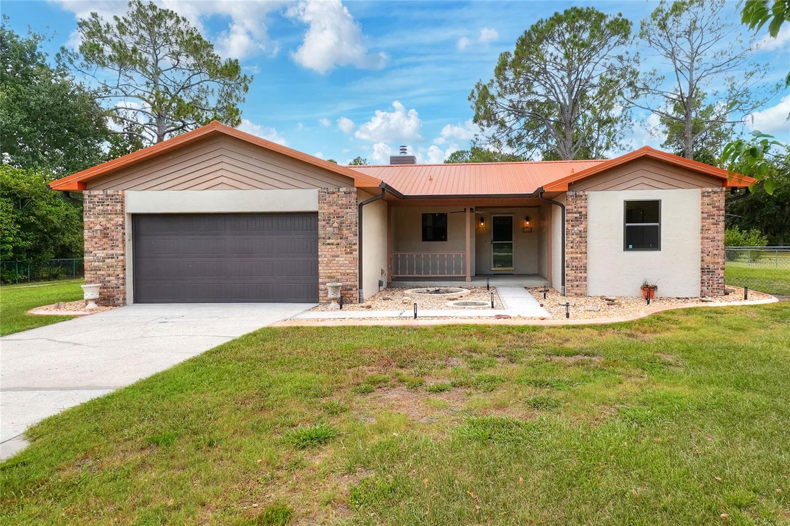 Just What You’ve Been Looking For!
This beautiful home sits on a large lot with NO HOA, offering space, freedom, and incredible value.
Step into the updated kitchen, featuring a pantry, new stainless steel appliances, fresh paint, stone countertops, wood cabinetry, and a stylish new backsplash—making it a true standout.
The home offers an open floor plan with a cozy wood-burning fireplace, perfect for entertaining and creating lasting family memories. Durable porcelain tile flooring runs throughout most of the home, and the seller is offering a flooring allowance for the bedrooms.
The split-bedroom layout provides privacy, with the primary suite featuring a walk-in shower and large closet space. The guest bathroom includes a convenient shower/tub combo. You’ll also appreciate the added functionality of a mudroom. and separate laundry room
Major updates include:
• Metal roof (2023)
• Bosch A/C unit (2021)
Outside, enjoy plenty of green space, much of it fenced, along with exceptional features for storage, hobbies, or business use:
• Two garages
• 28 x 32 canopy/carport
• 30 x 50 steel workshop
    • 200-amp separate metered service
    • Wired for shop use
    • Overhead lighting and exhaust fan
This property truly has it all—space, upgrades, and versatility.
Don’t miss this incredible opportunity—schedule your private showing today!