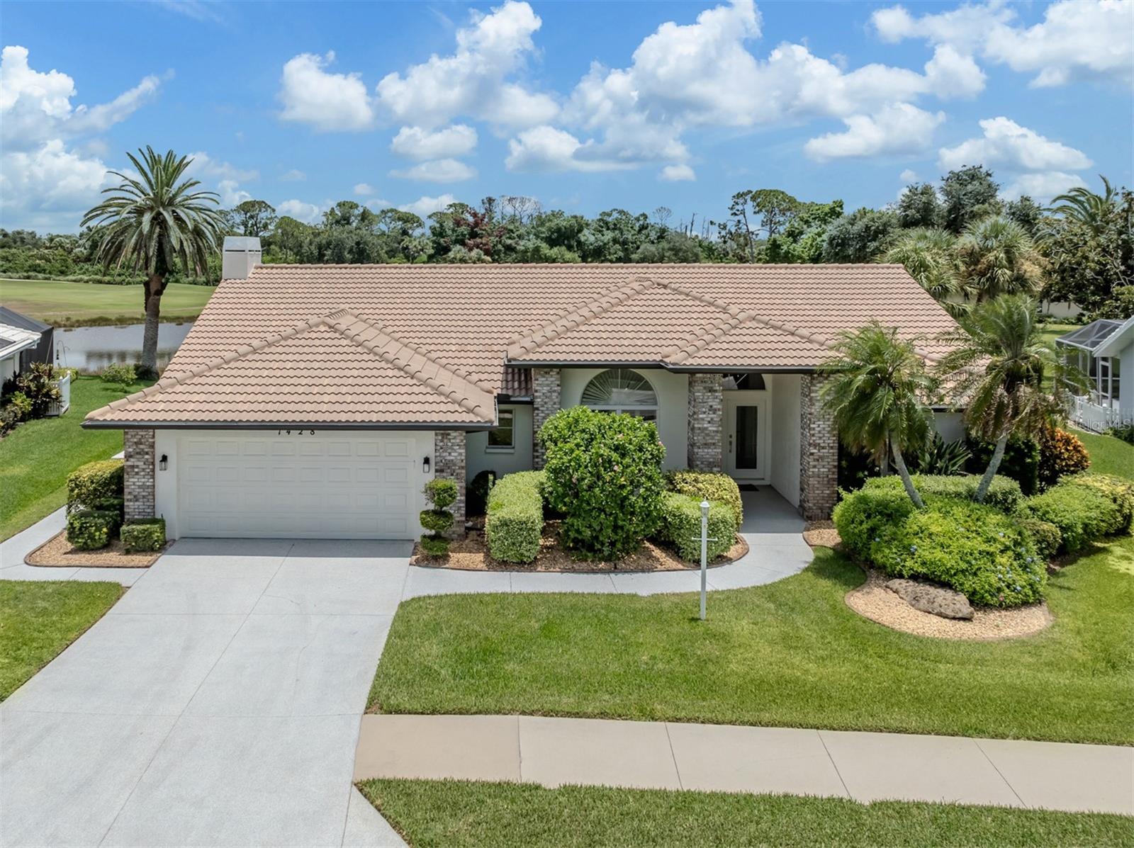 Experience luxury Florida living in this beautifully updated, fully furnished (colorful cabinet in living room excluded) three-bedroom, two-bath home with 2,429 square feet in the gated golf community of Waterford. Featuring soaring ceilings, a desirable split floor plan, formal living and dining rooms, a spacious family room with wood-burning fireplace and an oversized two-car garage, this home is designed for comfortable living and entertaining. Double glass entry doors open to abundant natural light and stunning views of the heated pool, tranquil water and award-winning golf course. The spacious primary suite offers private lanai access, dual walk-in closets, and a remodeled spa-like bath with solid wood soft-close cabinetry, quartz countertops, dual vanities, soaking tub, and glass-enclosed shower. The updated kitchen features solid wood soft-close cabinetry, quartz countertops, newer appliances, pullout shelving, breakfast bar with extra storage, decorative backsplash, pass-through window to the lanai and a casual dining area. Two guest bedrooms with walk-in closets share a full bath that also serves as a convenient pool bath. Enjoy the expansive screened lanai with covered seating and dining areas, outdoor shower, storage closet, and heated pool and spa overlooking picturesque golf course and water views. Major updates include 2024 exterior paint and pool lights, 2022 complete interior remodel with new family room windows, double glass front entry doors, garage doors, water heater, pool heat pump and whole-house water purification system, 2021 pool cage, pool resurfacing and driveway, 2020 air conditioner, 2017 pool deck and 2011 roof. This move-in-ready home offers exceptional updates, spectacular views and the best of the Florida lifestyle. One low HOA fee of $2,232 annually and no CDD provide the owner with Waterford amenities including heated pool, lighted Har-Tru tennis courts, pickleball, hot tub, social room with kitchen, dance floor and fitness center, with corn hole and bocce ball courts coming soon! Golf memberships are available but not required. The golf club has a restaurant with no minimums. Easy access to Interstate 75, U.S. 41, pristine Gulf beaches, shopping, dining, medical, quaint downtown Venice, new Sarasota Memorial Hospital, CoolToday Atlanta Braves spring training ballpark and new downtown Wellen Park.