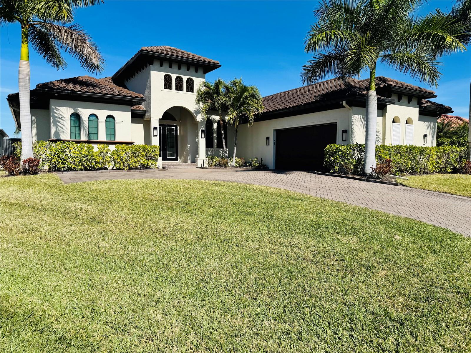 Stunning contemporary residence showcasing a bright, open layout with high ceilings and premium finishes throughout. The chef’s kitchen features sleek modern cabinetry, expansive stone countertops, and stainless-steel appliances, ideal for both everyday living and entertaining. The spa-inspired primary bathroom offers designer tile work, a walk-in rain shower, and dual vanities.

Enjoy a dedicated office perfect for remote work, along with a media room featuring built-in acoustic panels, projector, and a professionally installed AV/smart home system with centralized equipment rack for whole-home audio, video, and automation. Step outside to a beautifully designed outdoor pool area, ideal for relaxing and entertaining