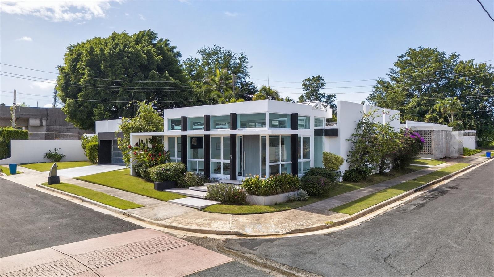 Stunning fully remodeled residence in one of Guaynabo’s most sought-after neighborhoods. Bright, expansive interiors with contemporary finishes and a gourmet kitchen loaded with premium appliances. The striking outdoor area—complete with a modern pool and manicured garden—is perfect for entertaining. An exceptional home for discerning families seeking comfort, style, and privacy.

Property Highlights:

- Sale Price: $1,890.000
- 4 Bedrooms
- 4.5 Bathrooms
- Approx. 3,664 sq.ft of living area 
- Approx. 809.09 sqm lot (corner lot)
- Fully renovated home
- Entrance foyer with plenty of natural light 
- Fully equipped kitchen
- Laundry room
- Private family room with powder bathroom
- One bedroom with hallway bathroom
- Two bedrooms with jack and Jill bathroom
- Ample owner’s suite with walk-in closet
- Spacious and covered terrace with outdoor kitchen 
- Sleek modern pool
- Landscaped garden and outdoor entertaining areas
- 2-Car garage with enlighten EV car charger
- Solar PV system and emergency power generator 
- 600 gals water cistern and 30 gallons solar water heater
- Automatic patio irrigation system
- Low voltage lighting for patio and paved areas
- Year built: approximately 1960’s
- CRIM: $4,311.01/ year
- HOA: $300 /month
- Zoning R-B [former R-1]