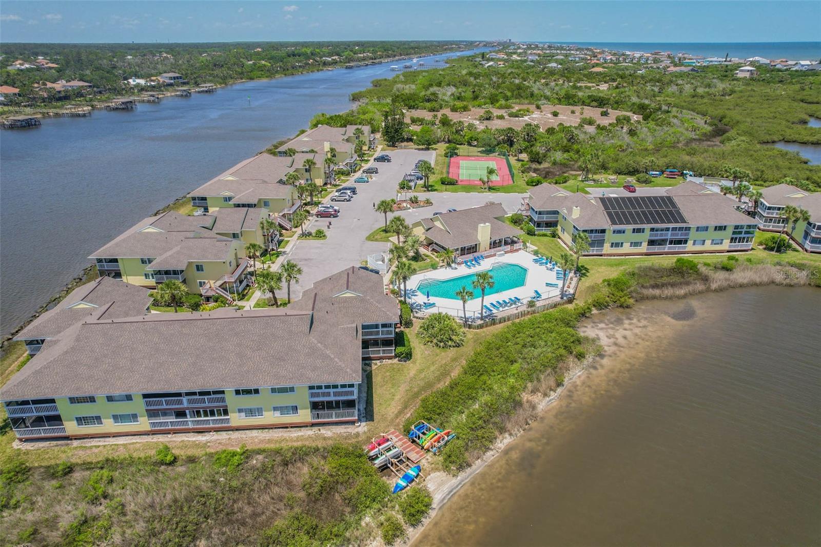 Imagine waking each morning to salty ocean breezes, watching dolphins play from your private screened balcony, and ending the day listening to the soothing sound of waves from your front balcony. This beautifully situated second-floor, two-bedroom, two-bath condo offers more than a place to live—it offers the relaxed Flagler Beach lifestyle you’ve been dreaming about.

Inside, you’ll find hurricane-impact windows and doors for added peace of mind, spacious walk-in closets, and a comfortable layout perfect for full-time living, a coastal retreat, or a seasonal getaway. Best of all, this property has experienced no flooding.

Tucked away in a quiet, private community, you can enjoy resort-style amenities just steps from your door, including an inviting in-ground pool, clubhouse, exercise area, tennis and pickleball courts, scenic walking trails, kayak storage, and a convenient kayak launch. When you’re ready for sand and surf, the beautiful beaches of Flagler Beach are just a short walk away.

Outdoor enthusiasts will love the community grilling areas located near the inlet connecting the Intracoastal Waterway and Silver Lake—an incredible setting for relaxing by the water, launching a kayak, or casting a line. Fish for flounder, redfish, snook, and even catch blue crabs, all without leaving your community.

The condo also includes a designated numbered parking space along with plenty of convenient guest parking.

Whether you’re sipping coffee while dolphins glide through the Intracoastal, spending the afternoon kayaking and fishing, cooling off by the pool, or falling asleep to the distant rhythm of the Atlantic Ocean, every day here feels like a vacation.

Come experience the peaceful coastal lifestyle, natural beauty, and small-town charm that make Flagler Beach one of Florida’s most treasured seaside communities. Your waterfront escape is waiting.

Listing agent is the owner. Feel free to call with any questions.