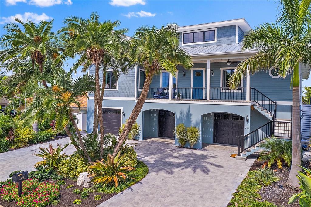 Coastal Dream Home on Vina Del Mar Island!  Built as their Forever Home, this is a truly unique waterfront opportunity to be your Future Home.  Quality construction, fabulous floor plan, amazing high end finishes and so many surprise amenities make this home one of the best homes on the market.  The property highlights are extensive but some of the attributes include; Custom Kitchen 10 ft cabinets with recessed doors designed for optimal function and fun.  High end appliances that truly make even a novice cook feel like a chef.  Wide plank hardwood flooring throughout the home, Cathedral ceilings, Anderson impact rated casement windows and french doors, 10 ft ceilings throughout with 8 ft solid oak raised panel doors, motorized blinds, smart home technology including "Picture Frame" TV's, all bedrooms offer ensuite, oversized block elevator shaft, 3 bay garage with 10' ceilings and workshop, 22 KW whole house generator, new seawall, new composite dock and lift.  Huge backyard offers plenty of room for activities.  Situated on the southern tip of St Pete Beach, the only access on the island is from Historic Pass A Grille which offers charming shops and fishing village style restaurants.  Vina Del Mar is a walking, biking and golf cart community so there are so many ways to enjoy the beach and community.  An easy 15 mins to Downtown St Petersburg to enjoy all the world renowned museums and trendy restaurants. Just 30 Mins to Tampa Int'l Airport makes business or personal travel a breeze.