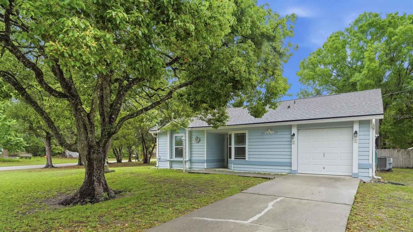 PRICE IMPROVEMENT! Welcome to your private DeBary retreat! This beautifully maintained 3-bedroom, 2-bath home sits on a spacious, private corner lot, high and dry for peace of mind—with no HOA!
Step inside to a desirable split floor plan designed for comfortable living. The kitchen features a cozy eat-in area, along with a pass-through window to the great room—perfect for easy entertaining. The great room boasts high ceilings and skylights, creating a bright, airy space filled with natural light.
The primary suite includes a private ensuite bathroom and is positioned separately from the secondary bedrooms for added privacy.
Enjoy relaxing on the screened-in patio, ideal for morning coffee or unwinding in the evenings.
Recent updates include energy-efficient windows (2020), a NEW ROOF (2023), NEW A/C (2023), and newer interior and exterior paint—providing lasting value for years to come.
Located just minutes from I-4 and the DeBary SunRail Station, this home offers easy access to Orlando, the beaches (approximately 30 minutes), and theme parks (approximately 40 minutes). Close to shopping and dining, this home truly offers the best of Florida living.
Schedule your showing today!