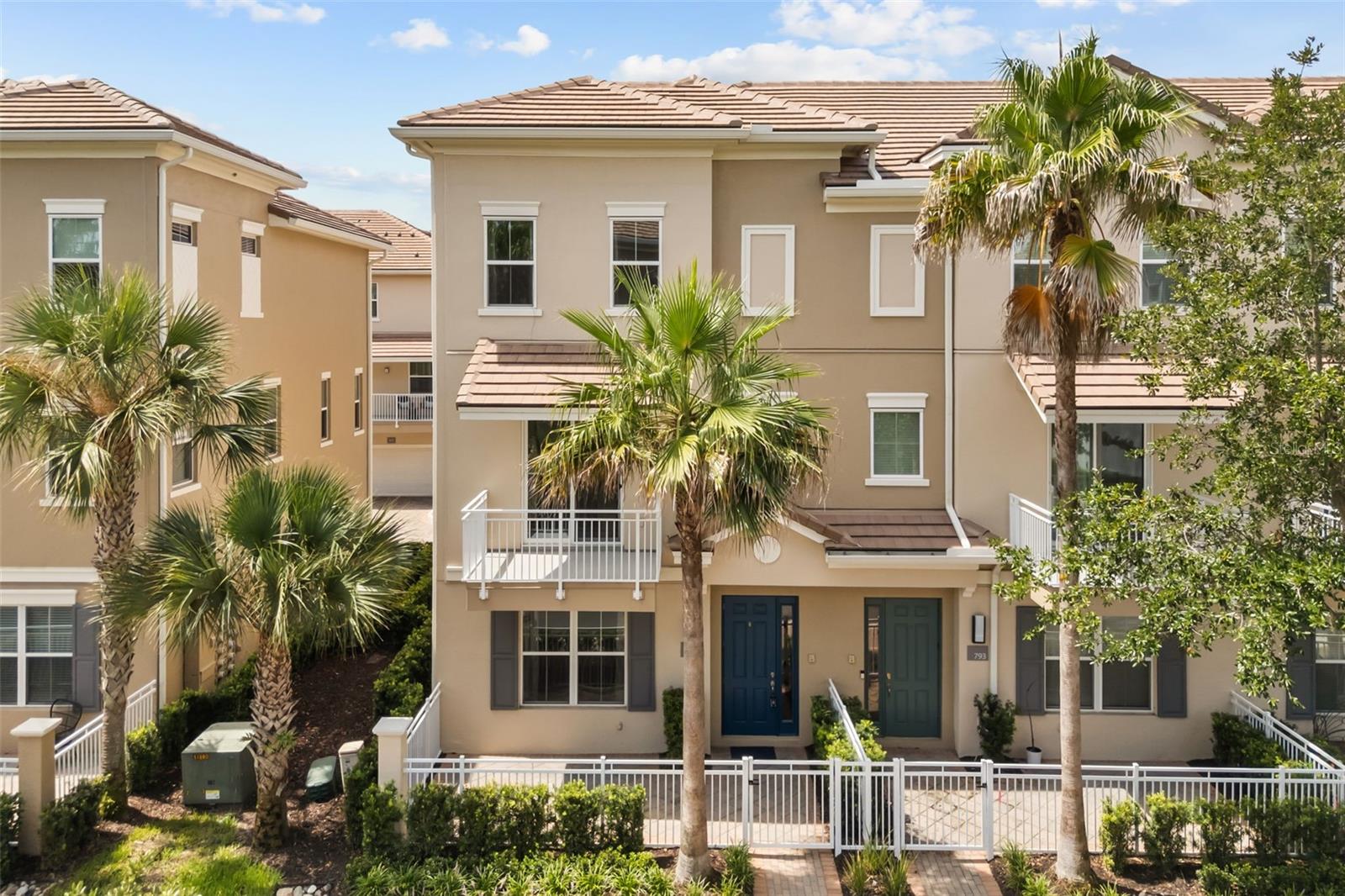 Former builder model end-unit with gorgeous finishes and water view! Live the maintenance-free luxury lifestyle in the ideal location close to everything. This picture-perfect townhouse has been immaculately maintained and it shows. Kolter "Evergreen" model with all the bells and whistles! Enjoy the relaxing water view of the serene community pond from your front fenced courtyard or second floor balcony located just off the living room. The first floor includes a handsome foyer, mudroom and a private, spacious bedroom with ensuite bath. Durable wood-look plank tile can be found throughout the first floor and stairs leading up to the living area. The impressive living area features large porcelain tile flooring, stylish decorative framing on the walls, trey ceilings and an abundance of windows with custom window treatments. The living room is open to the kitchen and dining area, offering a bright and airy feeling. The stylish kitchen features clean lines and a contemporary feel, with a sprawling island and breakfast bar, built-in oven and cooktop and quartz countertops. The beautiful dining room is light and bright with trey ceilings. Leading up the stairs and into the remaining bedrooms, you'll find comfy, high-quality designer carpet. The spacious primary bedroom is a retreat, including trey ceilings and window treatments. The swoon-worthy ensuite bath has a large walk-in shower, dual sinks and a generously-sized walk-in closet. The third bedroom has is own ensuite bath for ulitimate privacy. Laundry is conveniently on the third floor. This beautiful community has recently been revamped with new exteriors & fencing. Upgrades were completed on this building within the last year and include new roofs, balconies, energy-efficient windows, stucco and exterior paint! This highly-desired gated community is just steps from Colonial TownPark, the Seminole County Trail and features a community pool, gym, clubhouse and "pocket parks" scattered throughout the community. The reasonable HOA dues include high-speed fiber internet! Live just steps to a plethora of wonderful dining, shopping and even a movie theater!