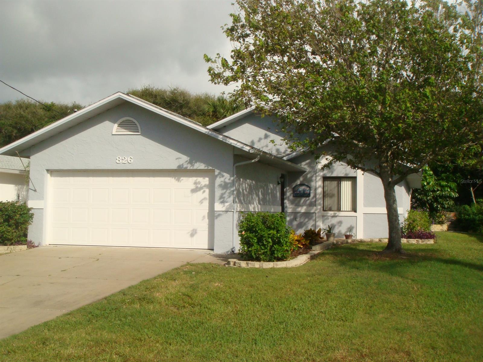 Walk just a few steps to the beach.  Enjoy the ocean breezes and head to the beach for your jogging, surfing and picnics. Desirable New Smyrna Beach beachside home offers volume skylight ceilings, an open floor plan with fireplace.  Enclosed Florida room.  Close to beach shopping and dining.  No Home Owners Association.  The back yard has stone landscaping with steps to take you to the back of the entire property.   New roof to be installed.  Owners are licensed real estate agents. ;Water: City