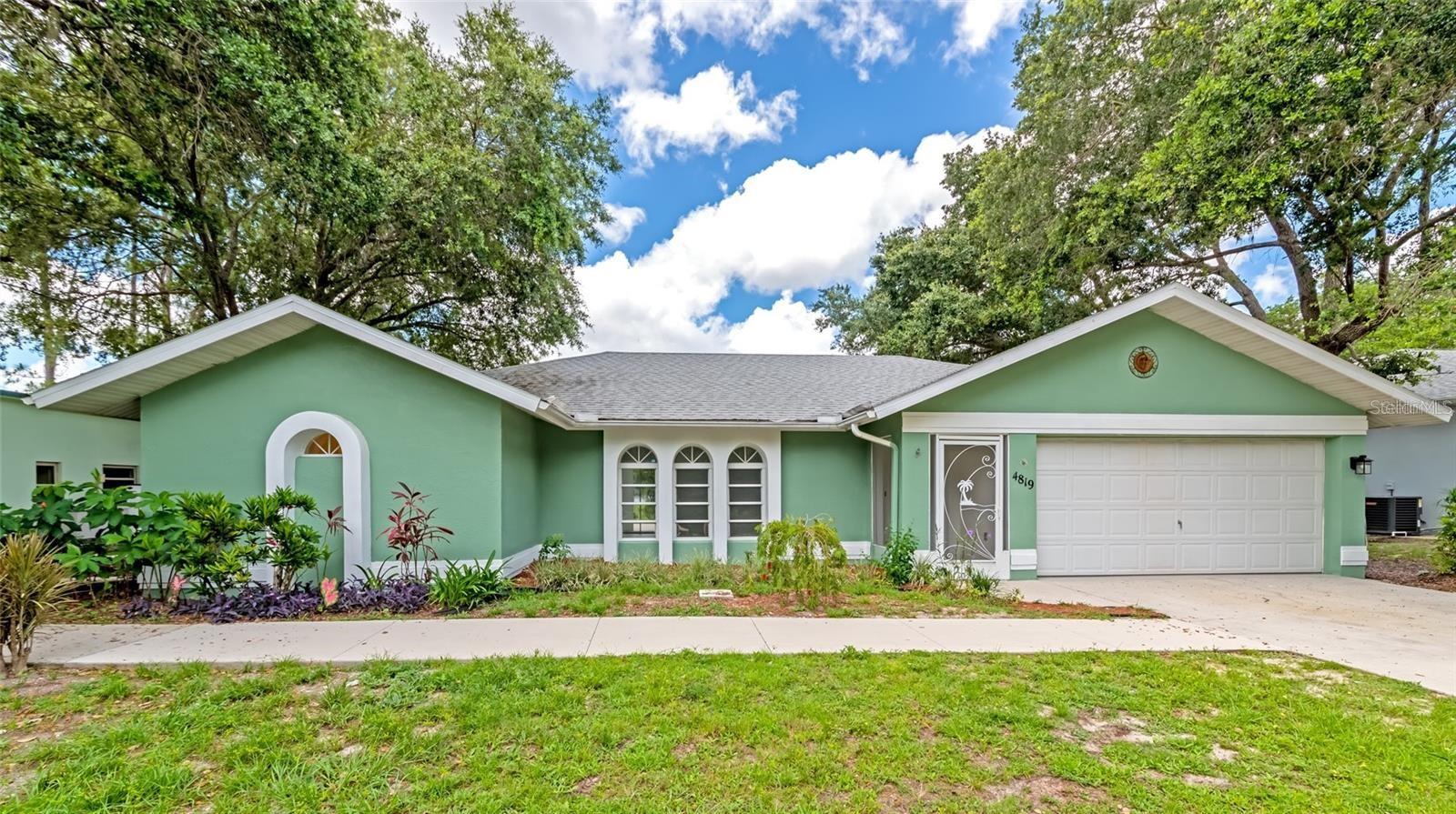 Gorgeous remodeled true 4 bedroom home with 2 bathrooms, a 2 car attached garage, and 1986 square feet of space. Split floor plan with 3 bedrooms on one side and the master on the other side. This is a large master with a large closet and a lovely ensuite bath that includes a free standing shower plus separate garden tub. Open kitchen with separate large living room accented by volume ceilings plus a large family room with sliders and access to the outdoor area. The flooring is tile throughout the main living areas and luxury vinyl plank in the bedrooms, no carpet in this home. The guest bathroom was just remodeled, and has a door leading to the patio and backyard. Last but not least, the outdoor space is magnificent! Pocket Sliders open to an oversized lanai with a huge yard. Large concrete patio allows for plenty of outdoor living space. This is truly one of a kind home that is spacious and not within a community that restricts vehicles or home use, in a quiet and private location, yet only 10 minutes away from all North port has to offer with shopping and entertainment.