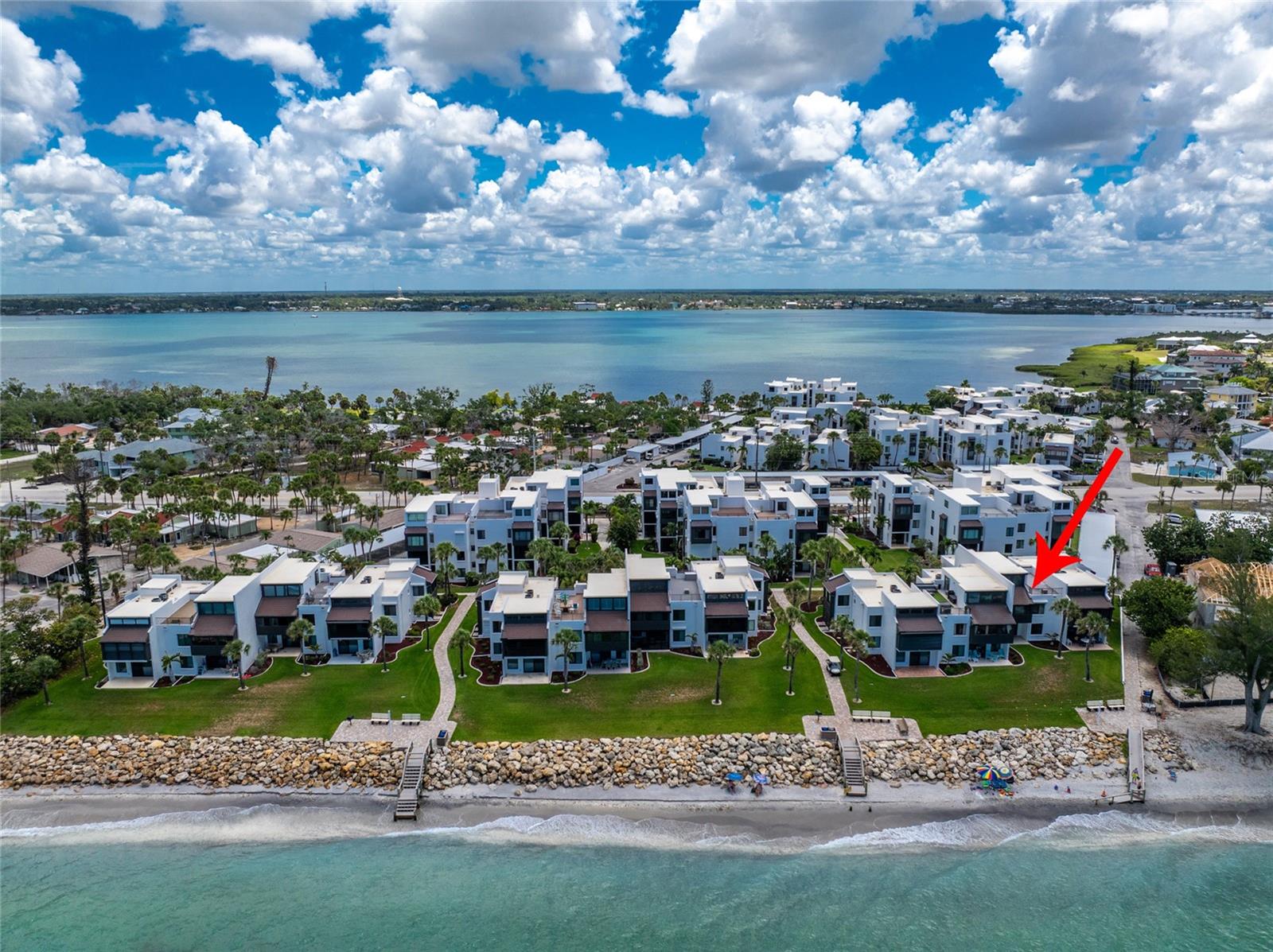 Experience the best of coastal living in this beautiful second-floor, two-story loft unit overlooking the beach and Gulf of Mexico at Tamarind Gulf & Bay Condominiums on Manasota Key, in Englewood, Florida. Wake up to breathtaking views of the Gulf from your very own beachfront oasis. Soaring high ceilings and oversized windows frame mesmerizing sunsets and unobstructed views of the beach and Gulf. Boasting a generously sized private sundeck with low-maintenance composite deck boards, indulge in the natural beauty of the beach amidst the rolling waves. The main living level encompasses a lovely, upgraded kitchen, and two upgraded bedrooms and bathrooms, all adorned with oversized tile flooring. The added allure of a versatile loft space, which is being utilized as a third bedroom, comes complete with an attached 3rd full bathroom and catwalk to the beachfront windows. Unit includes a downstairs owner's storage closet, perfect for stashing away beach essentials, golf clubs, fishing gear, and more. Tamarind Gulf & Bay is where you can experience condo and island living at its finest; lounge in your unit, on the beach, moor your boat in Lemon Bay, or swim in the heated community pool! Maintenance fee includes: water/sewer, cable TV, pest control, manager, and maintenance and insurance of all common elements and areas. Amenities for Tamarind’s residents include: a heated pool, clubhouse with full kitchen, 26 boat slips (1st come), boat ramp, assigned covered parking, BBQ areas and approximately 450’ of frontage on the Gulf of Mexico. Elevate your lifestyle with this coastal haven that promises not just a home, but an everyday escape to paradise.