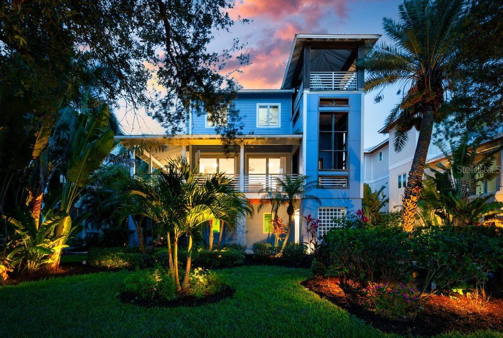 NEWLY PRESENTED & FULLY FURNISHED. Some homes invite you to exhale the moment you arrive. This is one of them.

Nestled within the award-winning Conrad Beach community on Longboat Key — ideally positioned west of Gulf of Mexico Drive — this elevated coastal residence is offered fully furnished as a true Gulf Coast retreat. Set within an intimate enclave of architect-designed homes, it delivers a rare combination of privacy, tranquility, and timeless coastal character that grows harder to find with each passing season.

Designed for effortless island living, the home pairs classic coastal architecture with resort-inspired interiors and a relaxed elegance that feels both welcoming and refined. Mornings begin with coffee on the porch as tropical landscaping sways in the Gulf breeze. Evenings unfold on the upper west-facing deck as golden light dissolves into the water. Thoughtfully designed landscape lighting transforms the grounds after dark, making every night feel like an occasion.

Inside, freshly refreshed interiors are curated for comfort, connection, and easy entertaining. The gourmet kitchen anchors the home around an oversized quartz island where guests naturally gather. Open-concept living spaces flow seamlessly outdoors, while a spacious lanai extends the entertaining footprint — with flexibility for future enclosure if desired.

The main-level primary suite offers a peaceful escape with its own private balcony overlooking lush tropical surroundings. Upstairs, guest bedrooms and a loft-style family room accommodate visitors with ease — equally suited to seasonal stays, remote work, or multi-generational living.

A two-car garage supports a true lock-and-leave lifestyle, while Firehouse Court's no street parking policy preserves the quiet, residential character of the neighborhood. Community amenities include a resort-style pool, entertaining areas, bath facilities, and observation spaces — all maintained through remarkably low HOA fees that cover lawn care, landscaping, irrigation, and common area upkeep.

For peace of mind, the home is equipped with high-impact windows and doors, a whole-house fire sprinkler system, and a full-house generator. For buyers seeking relief from crowded beaches and hurried routines, the contrast is immediate — life here is open, unhurried, and ready to enjoy from day one.

Just over the bridge, Anna Maria Island offers waterfront dining, boutique shopping, and the kind of authentic Old Florida charm that keeps everyone coming back. Minutes from the pristine beaches of Longboat Key's coveted north end, this is more than a home. It's where lasting memories are made, priorities reset, and a life you've been waiting to live finally begins.