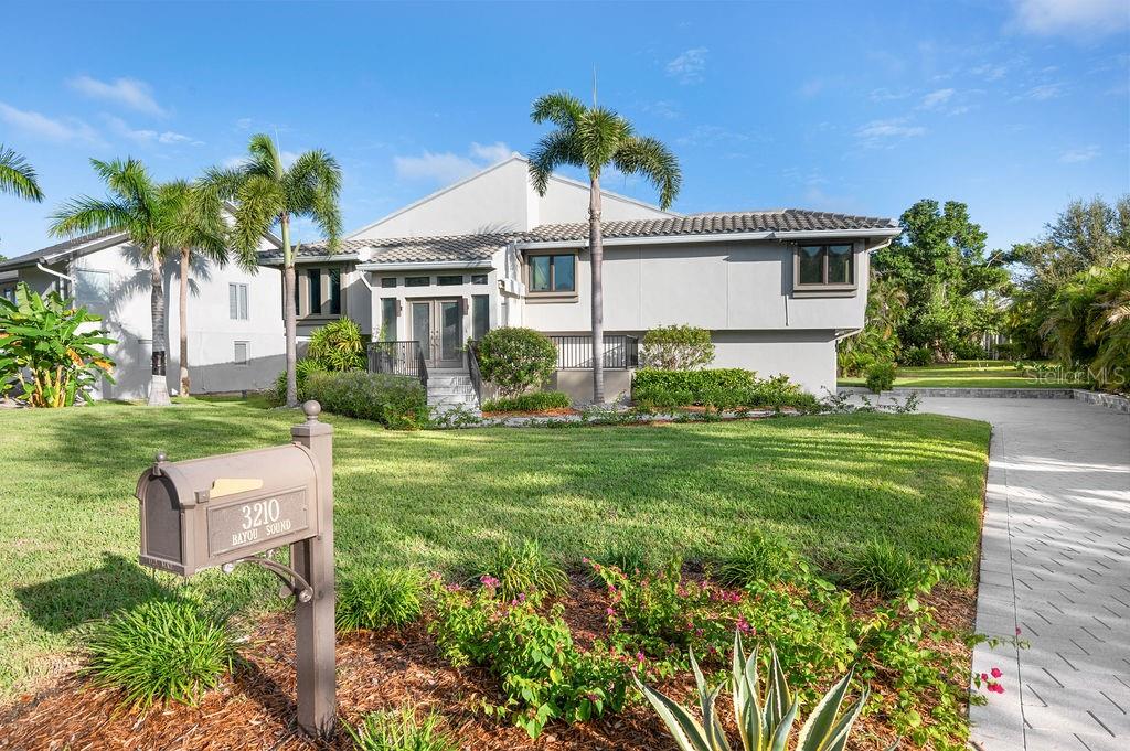 Motivated seller has a price improvement! This elevated retreat in the sought-after Bayou section of Bay Isles is ready for you! —A seamless blend of sophisticated design and relaxed coastal elegance. Encompassing nearly 2,100 sq. ft. of sunlit interiors, this residence offers an open-concept floor plan with soaring vaulted ceilings, creating an airy, inviting ambiance ideal for both everyday living and effortless entertaining. The expansive family room transitions beautifully into the contemporary eat-in kitchen, featuring clean, high-end finishes, abundant cabinetry, a large central island, and top-of-the-line stainless steel appliances that will delight. Thoughtful details such as graceful archways, ambient lighting, and tasteful materials add refined character throughout. Originally a 3-bedroom design, the home has been artfully reimagined to offer 2 bedrooms plus a dedicated office space—perfect for today’s flexible lifestyle. The oversized primary suite is a private sanctuary with a generous walk-in closet and a beautifully remodeled spa-like bath complete with double sinks and a fully tiled walk-in shower. The second bedroom is equally well-appointed, with direct access to an updated full bath. Sliders from both the kitchen and the primary suite open to the expansive screened upper-level deck with skylights—an ideal setting for al fresco dining, morning coffee, or sunset relaxation while overlooking the private lap pool, inviting patio, and meticulously refreshed landscaping. This residence offers true lock-and-leave convenience with a newer roof, advanced drainage system, updated landscaping, and low-maintenance, higher-end finishes that make it virtually maintenance-free. A rare 3-car garage provides ample space for vehicles and storage.

Residents of Bay Isles enjoy access to the exclusive Bay Isles Beach Club, where sugar-white sands and the Gulf’s turquoise waters await. Enjoy proximity to the Longboat Key Club’s world-class golf, tennis, and pickleball facilities, as well as the LBK Marina. Daily conveniences—including Publix, the Caron Family Pavilion, and town services—are just moments away. A short drive brings you to the fine dining, boutique shopping, and cultural treasures of St. Armands Circle and downtown Sarasota, with Sarasota-Bradenton International Airport only 15 minutes away. This is Longboat Key luxury at its finest—simply move in, unpack, and embrace the effortless resort lifestyle you deserve.