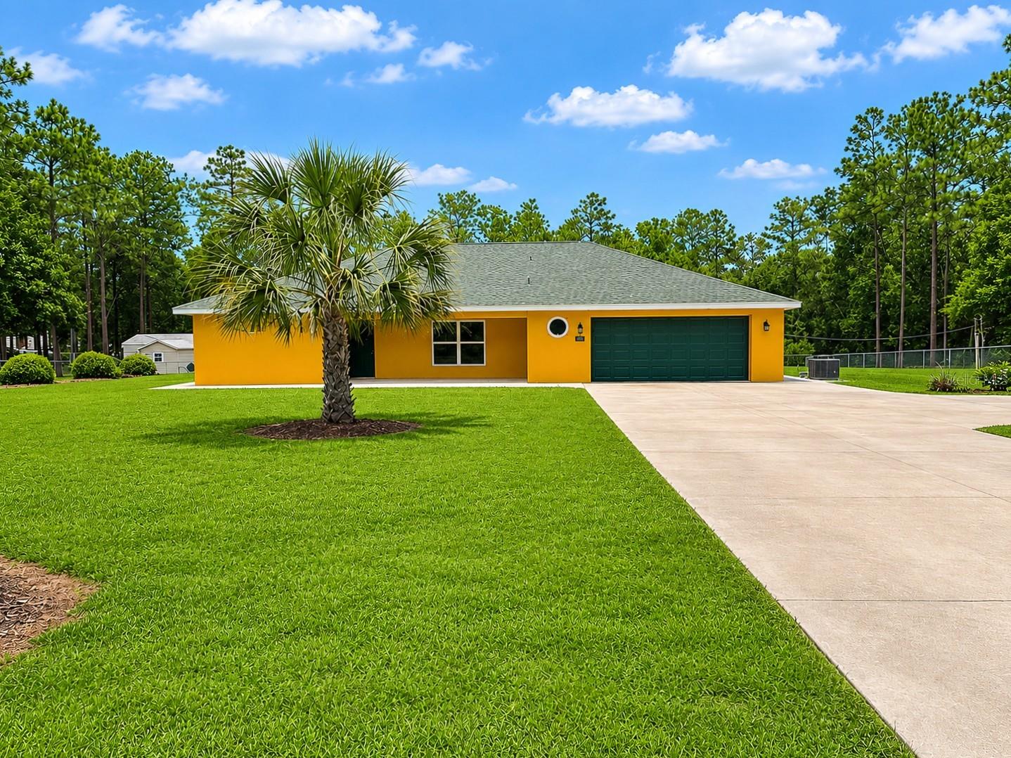 Experience a peaceful country living in the desirable Rolling Hills Unit 5 community, conveniently located just minutes from the World Equestrian Center and all that Ocala has to offer. Built by Triple Crown and meticulously maintained, this custom home offers quality craftsmanship and thoughtful design that sets it apart. Situated on 1.16 fully fenced and cleared, the property features attractive landscaping, an irrigation system, a spacious covered front porch, a wraparound sidewalk, and a large concrete driveway with plenty of parking. Inside, the popular split-bedroom floor plan showcasing durable luxury vinyl plank flooring, modern finishes, and an open, inviting layout. The well-appointed kitchen boasts granite countertops, stainless steel appliances, abundant cabinetry, and generous workspace for everyday living and entertaining. Additional highlights include a water softener, washer, and dryer—all included for added convenience. Don’t miss the opportunity to own this exceptional property. Schedule your private tour today and discover everything this beautiful home has to offer.