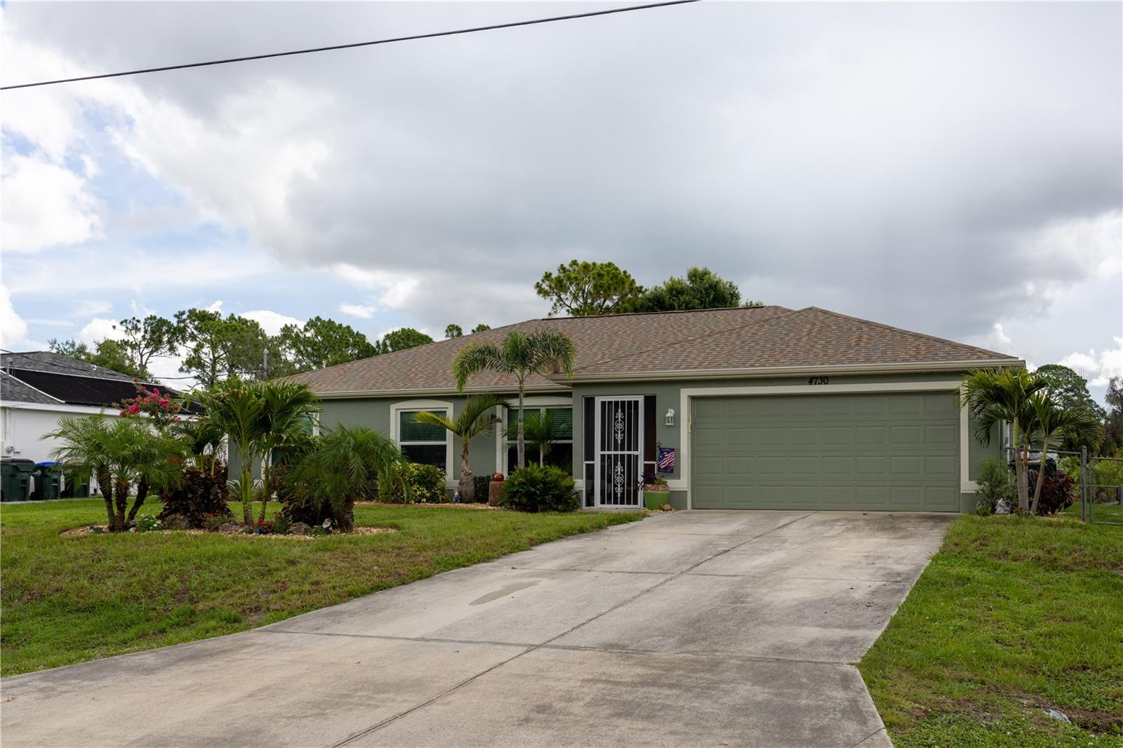 Welcome to your private Florida retreat! This beautifully updated 3-bedroom, 2-bath home with a den is situated on a freshwater canal and an oversized, fully fenced double lot totaling .46 acres. Offering the space, flexibility, and upgrades you've been searching for, there's plenty of room to bring your RV, boat, trailers, campers, and all your toys with ample parking and outdoor storage options.

Inside, you'll appreciate the thoughtful updates throughout, including luxury vinyl flooring (2021), 2" blinds throughout the home, and a stunning kitchen renovation completed in 2024 featuring 42" cabinetry, granite countertops, designer backsplash, and updated appliances (2020). The beautifully remodeled ensuite bathroom and new shower enclosure (2025) add a touch of modern luxury.

Step outside and enjoy your own backyard paradise. The pool area has been completely redone, including a pool resurfacing (2025), solar pool heating (2023), and a refreshed pool cage with new screening, paint, and hardware (2022). Whether hosting family gatherings or enjoying a quiet afternoon, this outdoor space is built for year-round Florida living.

The detached storage shed offers electricity and a 30-amp camper hookup, making it ideal for RV enthusiasts, hobbyists, workshops, or additional storage needs.

Major system upgrades provide peace of mind, including a new roof brought up to current code (2023), PGT WinGuard impact windows (2023), hurricane-rated front entry door (2023), Storm Smart roll-down shutters (2023), water heater (2023), new gutters (2021), and a 3.5-ton Rheem A/C system (2018).

This move-in ready property combines modern updates, extensive hurricane protection, an incredible outdoor living space, waterfront canal views, and a rare oversized double lot with room for all your recreational vehicles and equipment. Opportunities like this don't come along often!