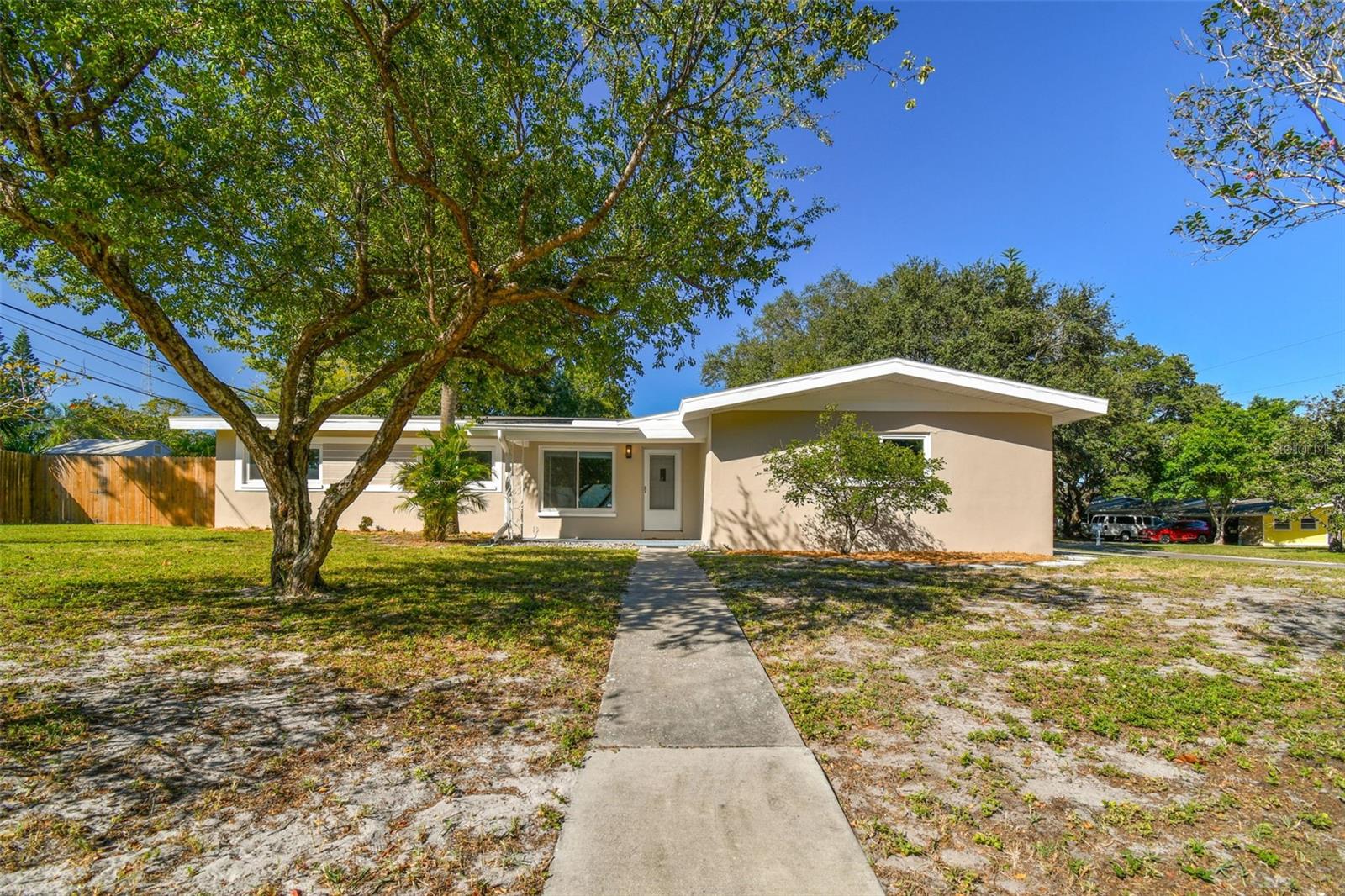 Walk into this house, and immediately feel like you are home. The corner fireplace welcomes you in and is just waiting to be decorated for the holidays! With 3 beds/2 baths and a 2-car garage, this home might just be the perfect home for YOU!!!! The convenient location means you are close to everything, including shopping, restaurants, the Tampa airport and the beach! And, convenience doesn’t stop with the location…interior laundry means you don’t have to walk into a hot garage to take care of that chore, making it a little more bearable! Plus, the windows have already been upgraded to impact, so relax knowing that is already taken care of for you! The entire home has also been freshly painted inside and out! Topping off this gem is the back porch, which is a great place to wake up with your morning coffee or relax at the end of the day. Come check out this home for yourself before it’s gone!!!