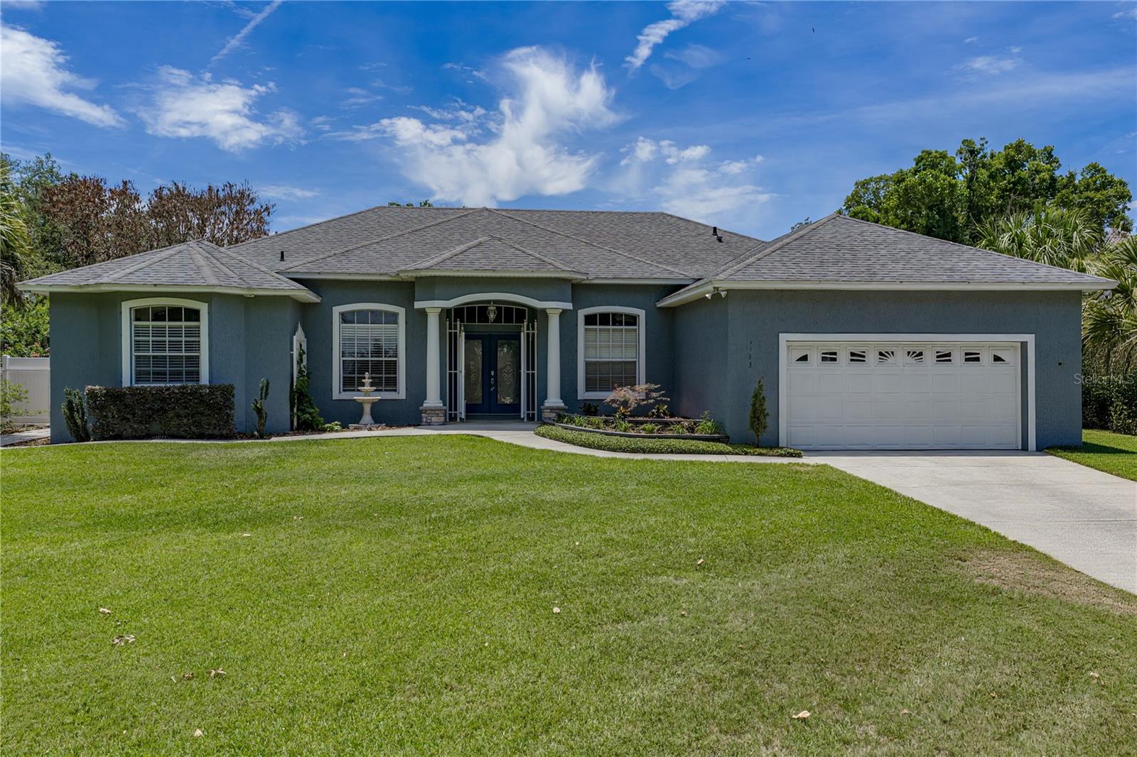 Welcome to Sugartree, one of Southeast Lakeland's most desirable established neighborhoods! This beautifully updated 4-bedroom, 2-bath home offers over 2,600 square feet of living space on a spacious .35-acre lot and combines the charm of an established community with the peace of mind of major recent improvements. Key updates include a NEW A/C (2026), roof (2020), water heater (2024), kitchen appliances (2020), porcelain tile flooring (2020), granite countertops, kitchen backsplash, updated lighting fixtures, refreshed kitchen cabinet facades, remodeled fireplace surround, updated bathroom tile, new blinds throughout, exterior paint, and a fully rescreened back lanai. Inside, you'll find a desirable split-bedroom floor plan with soaring ceilings, multiple living spaces, and abundant natural light. The spacious kitchen features granite countertops, ample cabinetry, generous prep space, and a large dining area, making it ideal for everyday living and entertaining. The family room is centered around a cozy gas fireplace, creating a warm and inviting gathering space. The oversized primary suite offers two walk-in closets and a spacious bath with a garden tub and separate shower. Adjacent to the primary suite is a dedicated office/flex room that serves as a potential 5th bedroom, complete with a window and proper egress, requiring only the addition of a closet. Step outside to enjoy the screened lanai overlooking the fenced backyard, complete with a detached workshop/storage building offering additional space for hobbies, tools, or equipment. Conveniently located near shopping, dining, medical facilities, parks, golf courses, and the Polk Parkway for easy access to Tampa and Orlando, this move-in ready home is a rare opportunity in one of Southeast Lakeland's most sought-after neighborhoods.
