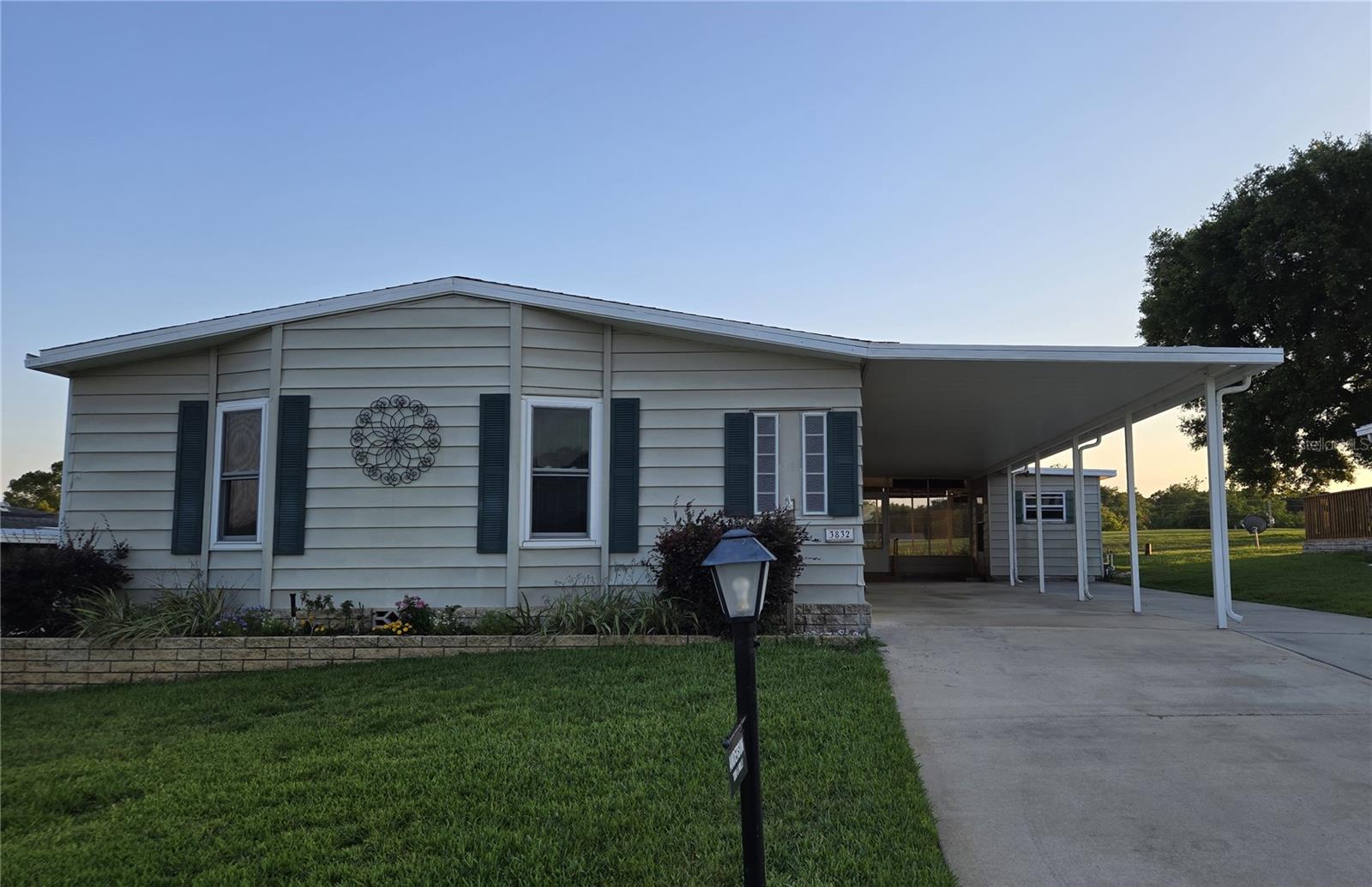 Beautifully renovated 1,761-square-foot, 2-bedroom, 2-bath home in Zellwood Station. This well-maintained Palm Harbor split bedroom home has manufactured wood floors throughout, a spacious primary suite with newly remodeled bath, a large living room ideal for entertaining, and an indoor laundry. The back of the house features a lovely IKEA kitchen with butcher block Island, a dining area, and a family room that together create a comfortable informal gathering space. From this area and the adjacent large screen porch you can watch golfers playing on 18th fairway The second bedroom has a very comfortable queen Murphy bed which, when not in use, allows for a multipurpose space. There is another Murphy bed just off the main living room so you will have lots of sleeping space for visitors. Double paned windows and a new a/c unit enhance energy efficiency. This home truly has it all. Zellwood Station is a Resident Owned 55+ Golfing Community located between Apopka and Mt Dora.  We have a 72 Par golf course, 4 pools, pickleball and tennis courts; water exercise and line dancing classes and our own Whistle Stop Restaurant and Lounge with banquet facilities. Also available is Community RV parking,reserved space available) There is always something to do here.  Close to the 429 for easy access to airports and attractions, we are close to shopping, restaurants, medical facilities and churches.  Come and see what we have to offer!