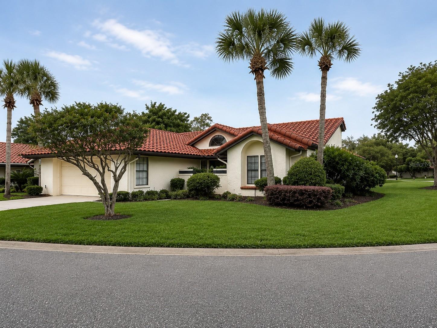Welcome to easy Florida living in this beautifully maintained 3-bedroom, 2-bath home nestled within a desirable guard-gated Jacksonville community centered around a scenic 13.75-acre lake. Offering 1,907 square feet of comfortable living space, this light-filled residence combines privacy, functionality, and a relaxed resort-style atmosphere.

Designed with an inviting split-bedroom floor plan, the home features spacious living areas accented by rich hardwood flooring, a cozy fireplace, and an open layout ideal for both entertaining and everyday living. Large windows and natural light create a bright, airy feel throughout, while the private backyard provides the perfect setting to unwind, garden, or enjoy outdoor gatherings.

The kitchen flows seamlessly into the main living spaces, and the attached 2-car garage adds convenience and storage. Additional features include tile and carpet flooring, central cooling, and a durable tile roof.

Residents enjoy a low-maintenance lifestyle with HOA-covered yard maintenance, community pool, tennis courts, sidewalks, and peaceful walking paths surrounding the lake. Conveniently located near shopping, dining, major roadways, and everything Jacksonville has to offer, this move-in ready home delivers the perfect blend of comfort, security, and carefree living in one of the area’s most established gated communities.