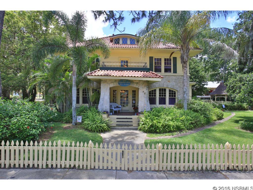 1912 Historic Registry Home,  currently operating as The Coquina Inn Bed and Breakfast. This property is located in the residential downtown Historic district of Daytona Beach on .26 acre corner lot and  can be used as Private Residence or is an opportunity to run an already established B&B!  Original hardwood floors, leaded windows, and Floridian artwork throughout. Downstairs has 3 common rooms including formal dining room W/ built-ins, Coquina sunroom W/Spanish tile, and large parlor complete W/ baby grand piano and coquina fireplace. Each of the four guestrooms has a Queen or King bed and a large private bath, with 3 rooms featuring claw-footed tub/showers. Fenced yard with canopy oak, palms, and flowering plants. Beautiful garden gazebo with jetted spa. Located 1.5 mi from beach and .5 mi from downtown area with shops, restaurants, and parks. 1 block from 500 wet/dry slip marina. Owners' quarters adjacent to kitchen includes bedroom with built-in bookcases and office. This is a turnkey business, complete with every item required to run a successful bed and breakfast. All TV's remain, many are new flat screen TVs; Linens include monogrammed towels and bathrobes, and luxury bedding. Dining room is complete with linens, flatware, and dishware service for 20. Kitchen is complete with disinfecting dishwasher and all appliances and cooking pans. Property has excellent expansion potential with 3rd floor Attic and Carriage House Bedroom suite. Daytona Beach has the amenities of a larger town due to tourism and the smaller adjacent towns of Ormond Beach, New Smyrna Beach and Port Orange. Guaranteed sellouts and higher rooms rates for 6 major events; excellent beach, golf, and romantic getaway traffic during other periods. Business has grown rapidly through aggressive marketing, online advertising and customer service, and is poised for additional growth and expansion. Inn is in immaculate condition with major upgrades complete. Additional room to expand owners' quarters ;Water: City