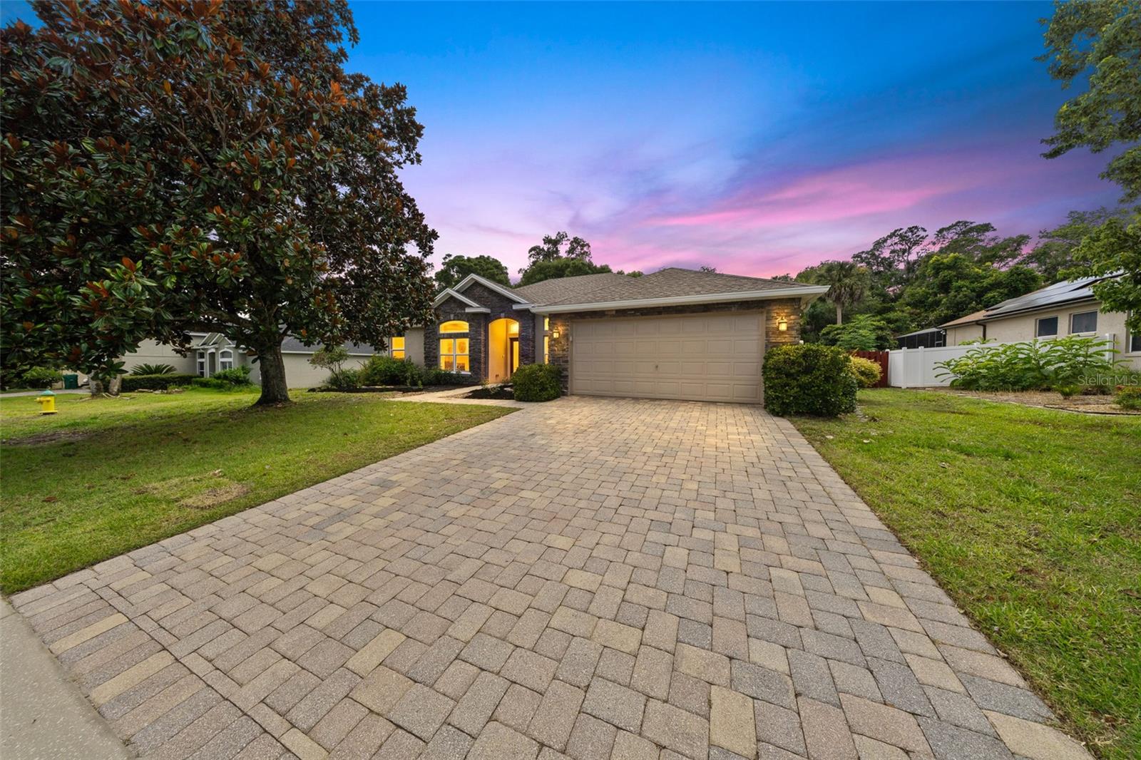 Welcome to your own private retreat in the highly sought-after Crystal Cove community of DeLand. Nestled on nearly half an acre, this beautifully maintained 4-bedroom, 2-bath home offers the perfect combination of space, privacy, and timeless comfort. With no rear neighbors and a backdrop of mature trees, you'll enjoy peaceful outdoor living in a serene setting. Designed with both everyday living and entertaining in mind, the open-concept layout features a desirable split bedroom floor plan, allowing for privacy while maintaining an inviting flow throughout the home. The spacious kitchen overlooks the main living area and offers abundant cabinetry, newer appliances, a gas range, a large walk-in pantry, and a casual dining space perfect for morning coffee or family meals. A separate formal dining room provides flexibility for entertaining or could easily serve as an additional sitting area. Just off the main living space, a dedicated office with French doors creates the ideal work-from-home setup or quiet retreat. The spacious primary suite is thoughtfully designed with comfort in mind, featuring dual walk-in closets and a luxurious en suite bathroom complete with dual sinks, a soaking tub, walk-in shower, private water closet, and French doors leading directly to the pool lanai, creating a true resort-style retreat. Step outside and discover your own backyard oasis. The expansive paver lanai surrounds the sparkling pool and spa, creating the perfect space for relaxing weekends, entertaining guests, or enjoying quiet evenings at home. Beyond the pool, the oversized backyard offers nearly half an acre of usable space with mature trees providing exceptional privacy, no rear neighbors, and a cozy firepit area that's perfect for gathering with friends and family under the stars. Additional features include an inside laundry room, attached two-car garage, elegant paver driveway, and numerous major updates already completed for peace of mind, including a new roof (2021), HVAC system (2023), hot water heater (2024), newer kitchen appliances, and a gas range. Located in one of DeLand's most desirable neighborhoods, Crystal Cove offers the perfect balance of tranquility and convenience. Enjoy easy access to award-winning Downtown DeLand, local shopping and dining, parks, medical facilities, top-rated schools, and I-4, making commuting to Orlando or the beaches a breeze. This exceptional property offers the privacy you've been searching for, the updates you'll appreciate, and the Florida lifestyle you've been dreaming of. Schedule your private showing today.