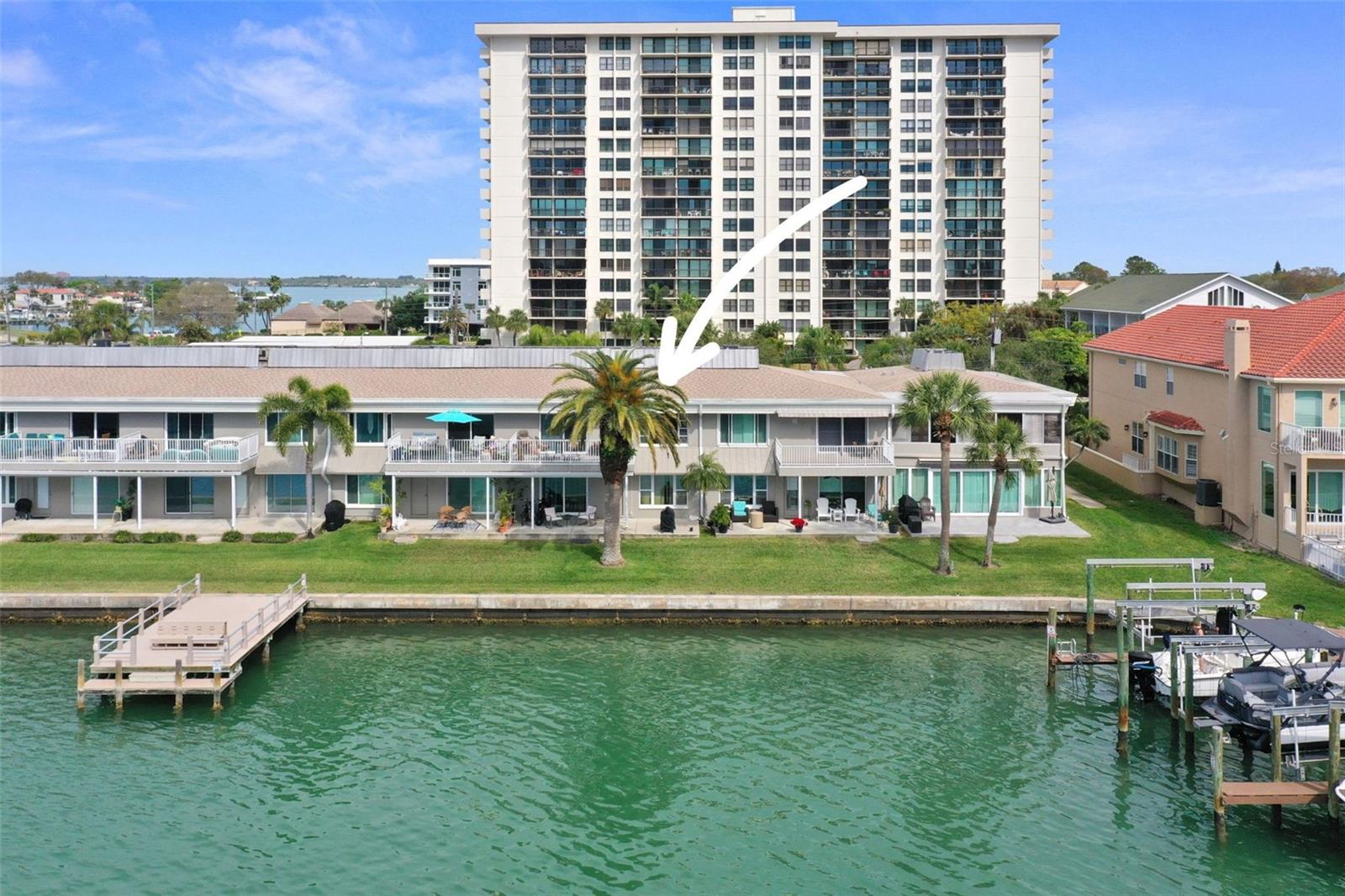 This waterfront condo on Island Estates offers a rare and highly desirable lifestyle, thanks to its prime ground-floor, west-facing position with sweeping views of Clearwater Harbor and the Intracoastal Waterway. Perfect for launching a kayak or paddleboard right from your backyard.
The two-bedroom, one-bath layout lives like a single-family home, creating a comfortable and inviting atmosphere. Inside, the updated kitchen immediately stands out, featuring solid wood cabinetry, granite countertops, and stainless steel appliances. The open-concept dining and living areas flow seamlessly together, while an expansive sliding glass door frames stunning water views and leads to your outdoor space—an ideal setting to relax and take in unforgettable sunsets.
Recent upgrades, including tile flooring and a beautifully renovated bathroom, add to the condo’s appeal. The primary bedroom serves as a peaceful retreat, complete with a large picture window overlooking the water. The spacious guest bedroom easily accommodates a king-size bed and includes double closets for ample storage.
Additional updates include a new A/C system (2021), a refrigerator (2020), and impact-resistant windows and doors for added security and energy efficiency. The property also includes an assigned carport parking space (#103) along with convenient guest parking.
Located within the deed-restricted Island Estates community, residents enjoy close proximity to everyday essentials, including a Publix grocery store, restaurants, banking, a post office, and a gas station—all just minutes away.
Combining a prime waterfront setting, thoughtful updates, and exceptional convenience, this condo offers the perfect blend of comfort, style, and coastal living.