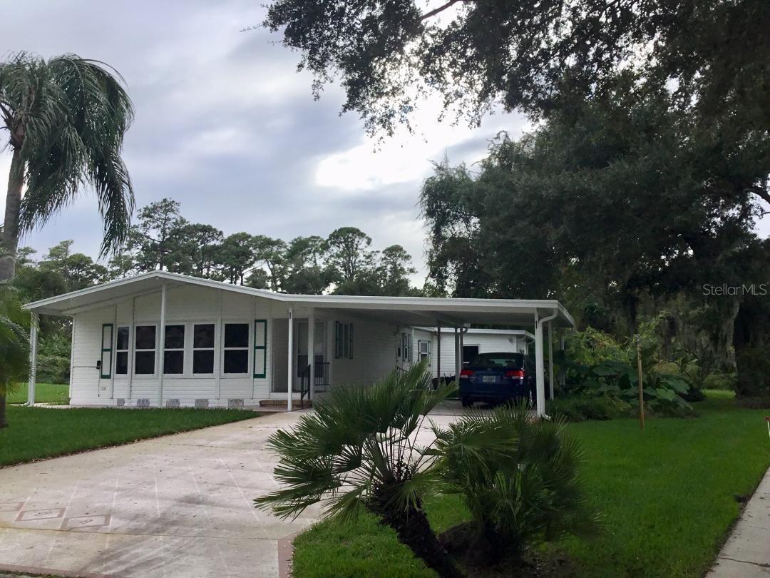 SPACIOUS Beautiful 2 bedroom Palm Harbor with open living and dining room.  Large island kitchen. Pantry and lots of cabinets. Family room has a wet bar.  Kitchen and family room look out to the large screen porch. Large Bay Windows in the living room.  New vinyl has been purchased for the screen windows but need installed. New plank flooring in almost every room installed 8/2019.  New roof 2018, A/C 2012, garbage disposal, refrigerator, washer and dryer 2014.  Inside laundry room with a separate outside door.  Cabinets in the laundry room.  Shed.  Covered carport holds several cars.  Sidewalk from driveway to the porch. Private backyard.  On a cul-de-sac.  Short walk to the clubhouse and activities. Immediate occupancy.

Edgewater Landing is located on the intracoastal with a boat or kayak access for residents only. Intracoastal fishing pier. Fitness center, woodworking shop, ceramics with kiln, tennis, bocci, shuffleboard, horseshoes, inside game room with pool tables, heated pool, screened sauna, entertainment committee (activities, dances, etc.).  RESORT LIVING EVERY DAY! HOA includes either a boat or RV space when available, cable and internet. ;Water: City