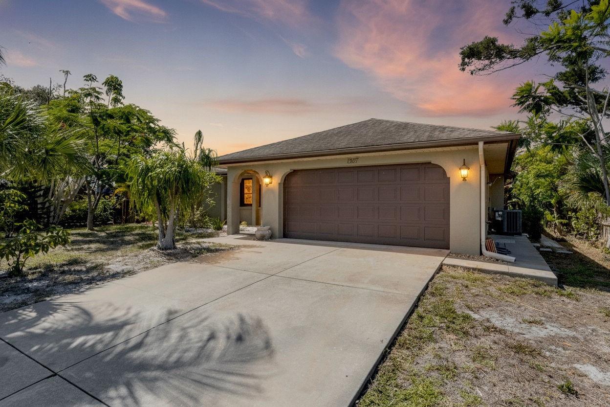 A Must See custom-remodeled home with a level of space, craftsmanship, and character that is rarely found.  Offering 3,058 square feet of living space, this 5-bedroom, 3-bath residence also includes a den, split floor plan, and 2-car garage, creating a flexible layout for family, guests, work-from-home needs, or multi-generational living.
Designed by an owner who is a general contractor, this home has a distinctive Spanish/coastal estate feel rather than the typical Florida remodel. The main living areas feature Saltillo tile ordered from Mexico, including the authentic character marks and occasional animal footprints that make true Saltillo tile so unique. The bedrooms are finished with American Hickory wire-brushed and hand-scraped wood floors in a rich sherry tone, adding warmth and texture throughout the private living spaces.
Custom details continue throughout the home, including Old Chicago Brick accents, built-in features, detailed trim work, and a Dimplex Revillusion fireplace that creates a strong focal point in the living area. These are the kinds of owner-designed touches that give the home personality and separate it from a standard remodeled property.
The large remodeled kitchen is both functional and refined, featuring granite countertops, stainless steel appliances, a ZLINE drawer microwave, soft-close cabinetry and drawers, and hand-painted tile behind the cooktop from Mexico. The kitchen and laundry room both include custom backsplash details, continuing the upgraded feel into the everyday spaces. Mostly Hansgrohe faucets and shower fixtures add another layer of quality to the kitchen and baths.
The primary suite is privately positioned within the split floor plan and features dual sinks along with sliding doors that open directly to the courtyard area. Just outside, the koi pond and fountain create a peaceful focal point and give the home a private retreat-style setting that feels completely different from the standard neighborhood floor plan.

Outdoor living is a major part of this property. The private screened lanai features a saltwater pool, custom pavers, and an outdoor kitchen complete with sink, refrigerator, and grill. It is a comfortable setup for entertaining, weekend cookouts, or simply enjoying the Florida weather without leaving home.
Located in an X flood zone, this home offers another valuable advantage for buyers. Set in the boating-friendly community of Overbrook Gardens, this property has access to an optional, low-cost HOA with a private community boat ramp and no-fixed-bridge access to the Intracoastal Waterway and Gulf. Manasota Beach, Historic Dearborn Street, Wellen Park, downtown Venice, local restaurants, shopping, golf, and everyday conveniences are all just minutes away.
With over 3,000 square feet, 5 bedrooms plus a den, a saltwater pool, outdoor kitchen, koi pond courtyard, imported Saltillo tile, American Hickory wood floors, Old Chicago Brick accents, hand-painted Mexican tile, upgraded fixtures, and owner-designed finishes throughout, this Overbrook Gardens home delivers space and craftsmanship in a way that feels refreshingly different.